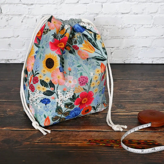 Pretty muted blue grey floral drawstring project bag.  This bag comes with or without pockets.  Made from RIfle Paper Co's Curio collection in Nova Scotia, Canada by Yellow Petal Handmade.