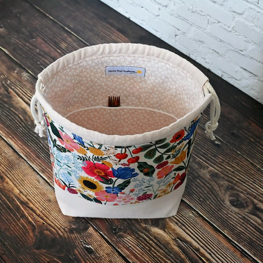 Pretty blush floral project bag in cotton and linen.  Closes with a drawstring and has pockets inside.  This bag is made with Rifle Paper Co's Curio collection by Yellow Petal Handmade in Nova Scotia, Canada.
