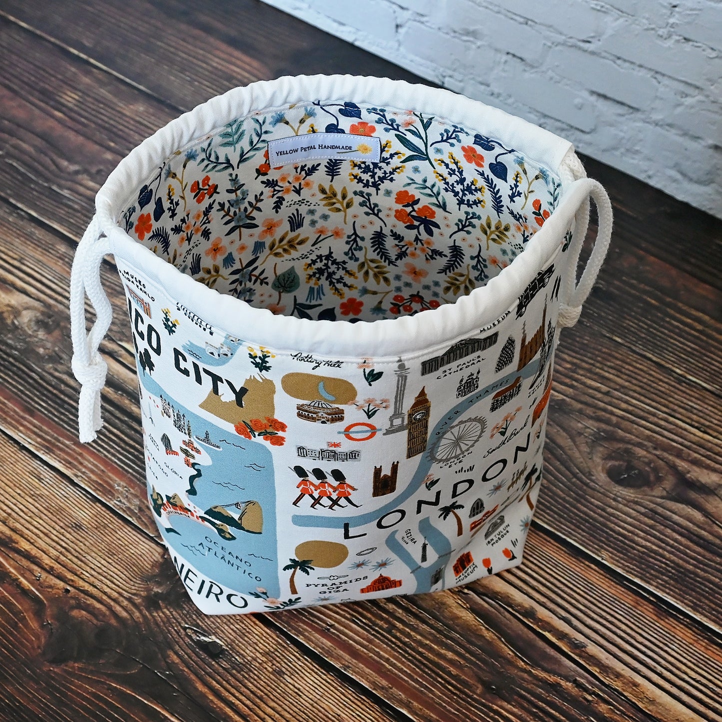 Fun drawstring project bags made from the World Traveller fabric collection by Rifle Paper Co. Bags come with a pretty floral lining and are available with or without pockets. Made in Canada by Yellow Petal Handmade.