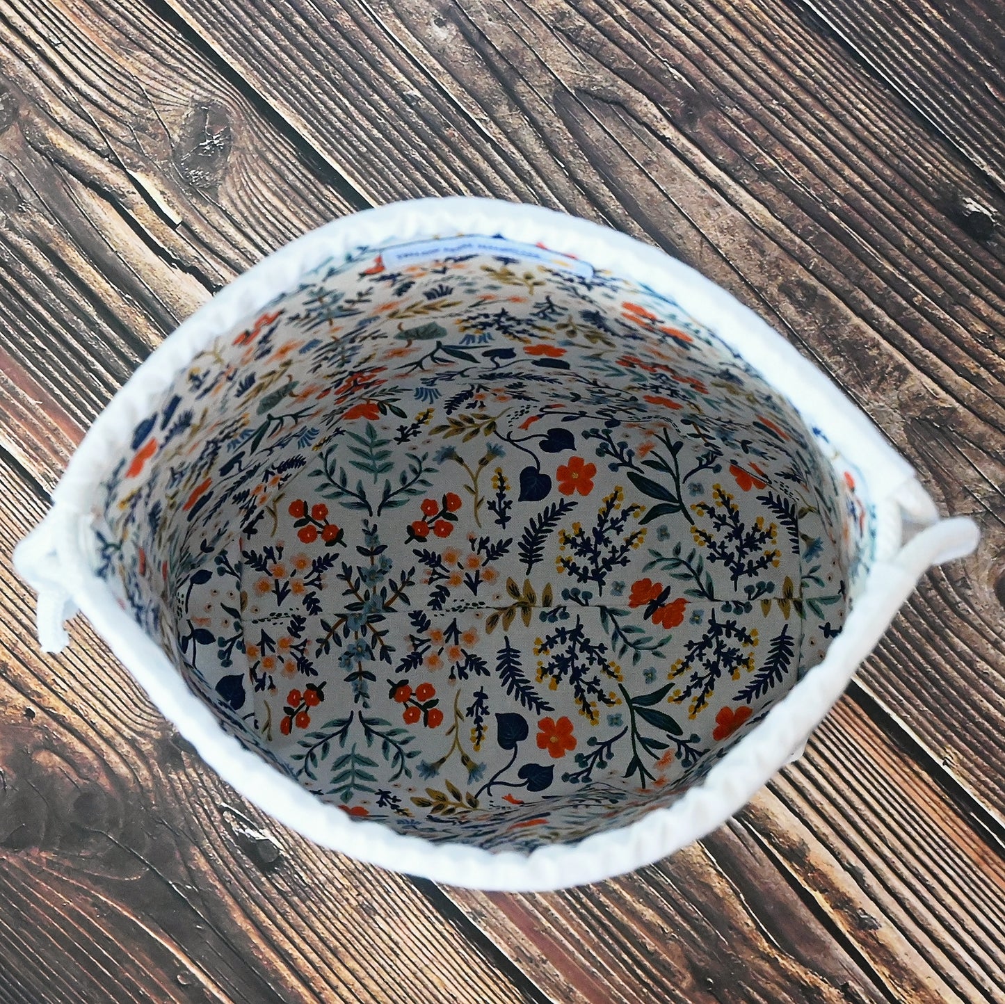 Fun drawstring project bags made from the World Traveller fabric collection by Rifle Paper Co. Bags come with a pretty floral lining and are available with or without pockets. Made in Canada by Yellow Petal Handmade.