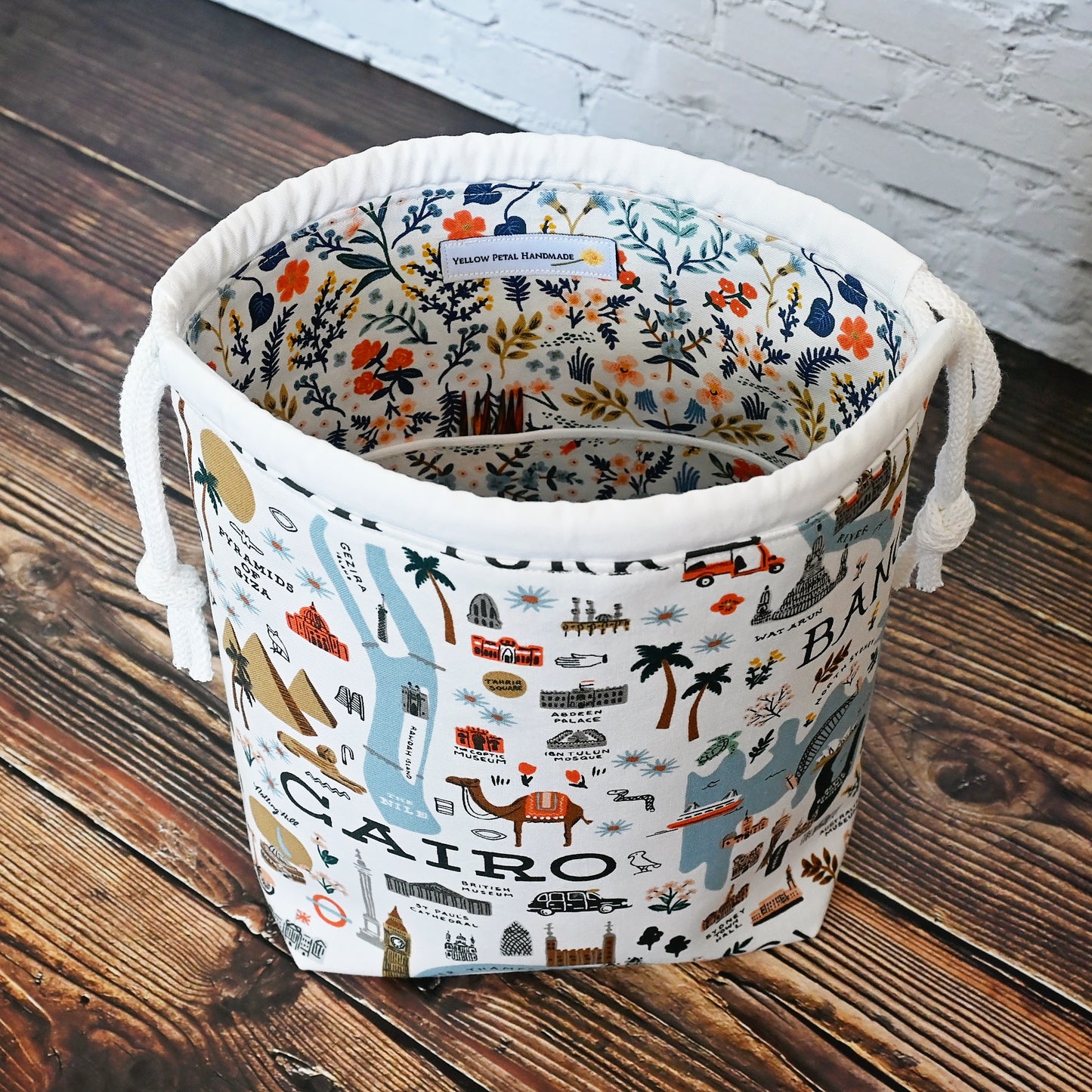 Fun drawstring project bags made from the World Traveller fabric collection by Rifle Paper Co. Bags come with a pretty floral lining and are available with or without pockets. Made in Canada by Yellow Petal Handmade.