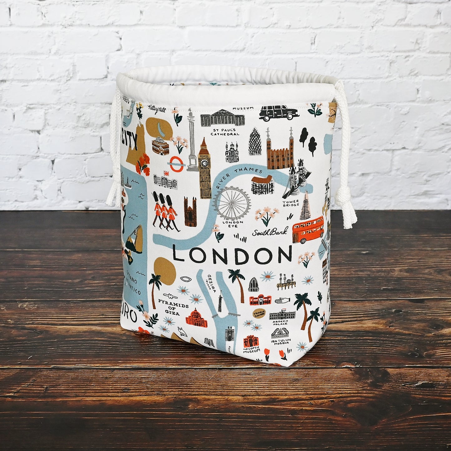 Fun drawstring project bags made from the World Traveller fabric collection by Rifle Paper Co. Bags come with a pretty floral lining and are available with or without pockets. Made in Canada by Yellow Petal Handmade.