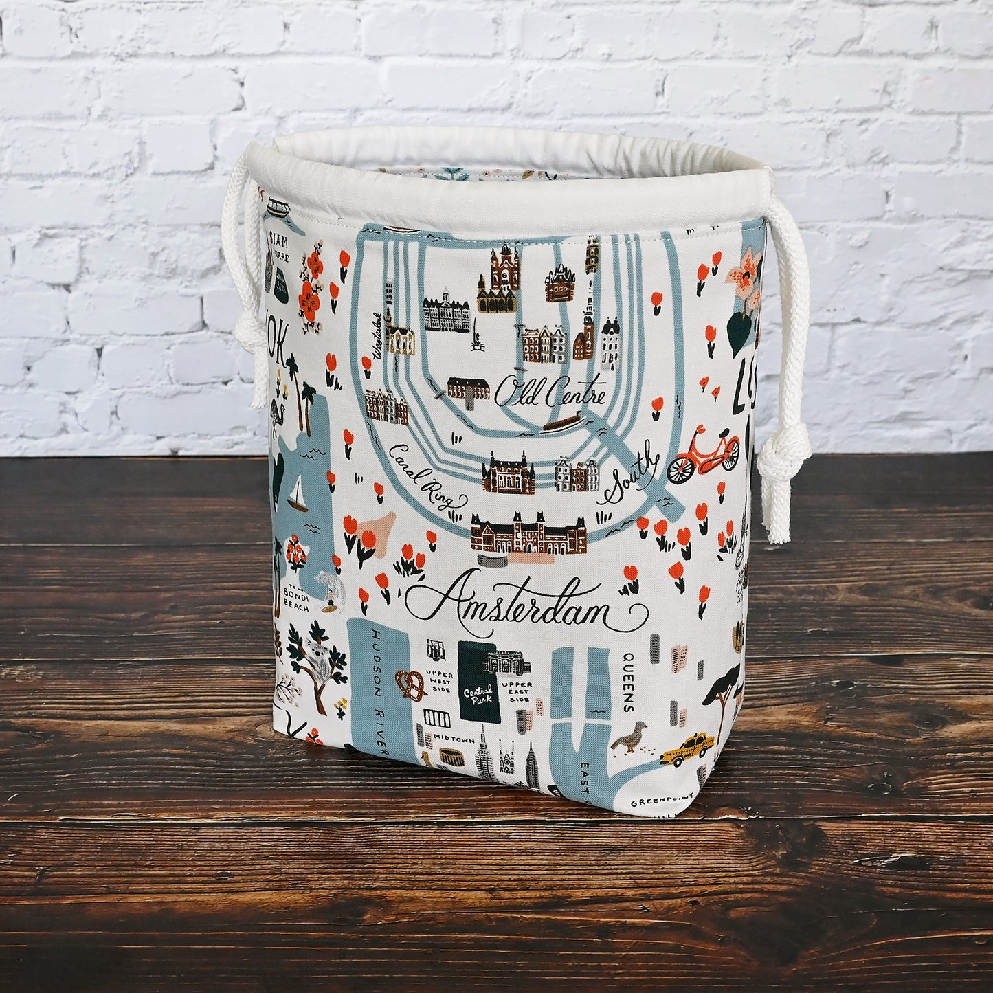 Fun drawstring project bags made from the World Traveller fabric collection by Rifle Paper Co. Bags come with a pretty floral lining and are available with or without pockets. Made in Canada by Yellow Petal Handmade.
