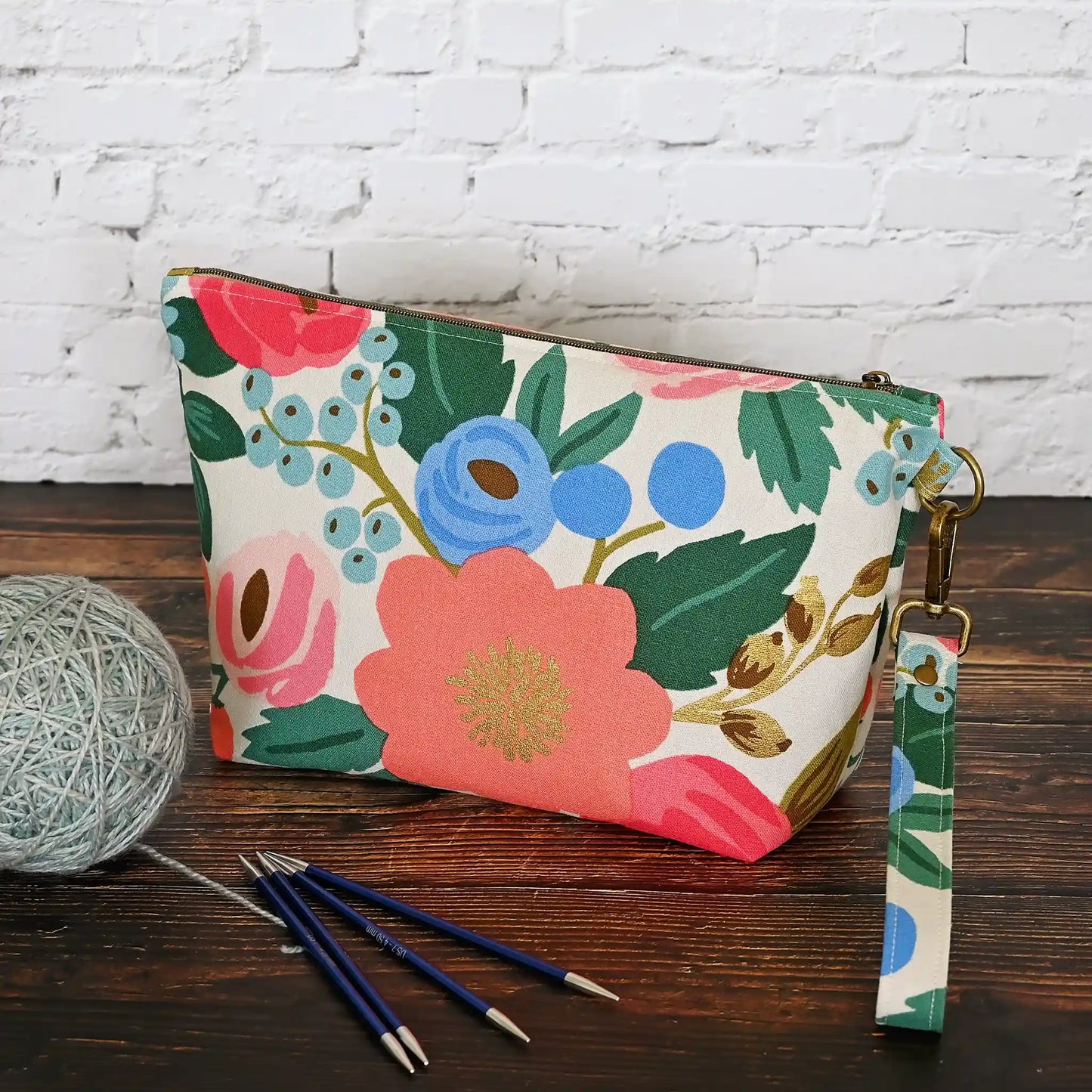 Cream floral canvas zippered pouch with removable wrist strap. Made from Rifle Paper Co's Antique Garden. Handmade in Nova Scotia, Canada.