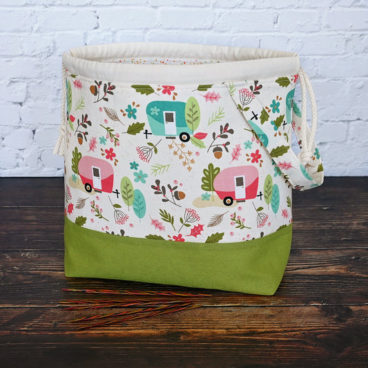 Cream and lime green camping themed project bag with a drawstring closure and carry handle.  The interior has a fun spotty print and pockets for storage.  Made in Nova Scotia, Canada by Yellow Petal Handmade.