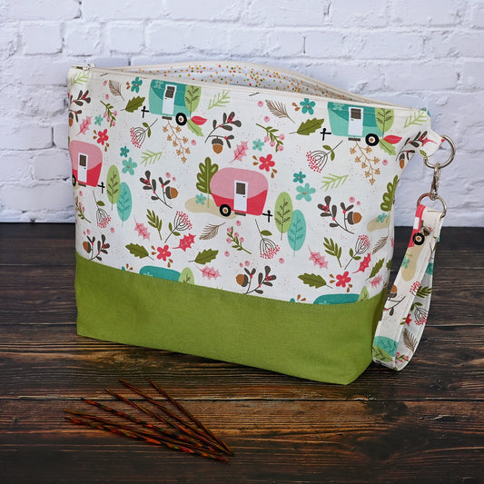 Cream and lime green camping themed project bag with a zipper closure and wrist strap.  The interior has a fun spotty print and pockets for storage.  Made in Nova Scotia, Canada by Yellow Petal Handmade.