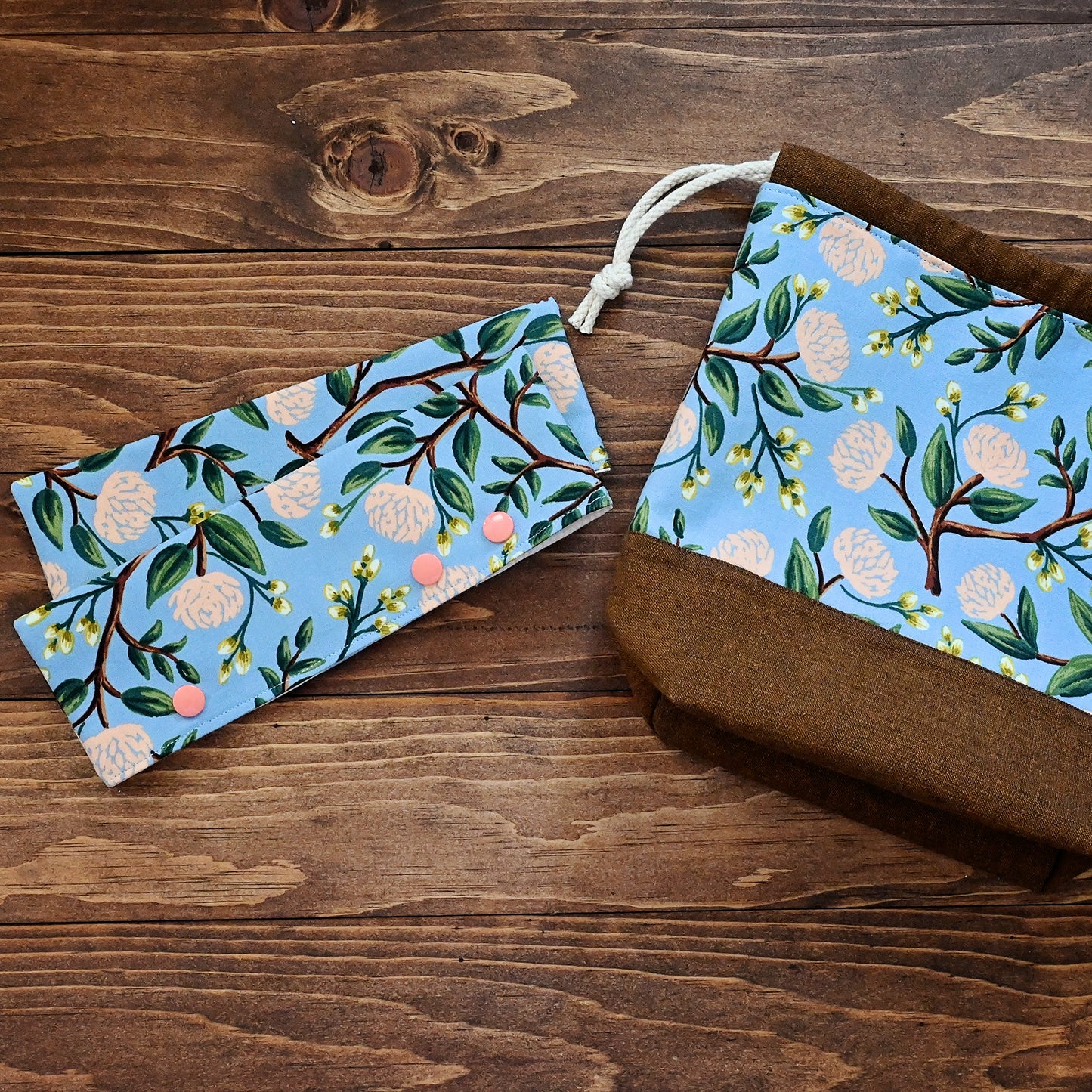 Pretty floral DPN cozies, perfect for keeping your projects on the needles! Crafted with a blue and peach floral from Rifle Paper Co, these close with snaps and hold your needles (and project) in place. Made in Canada by Yellow Petal Handmade.