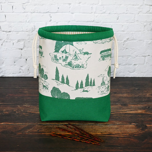 Classic cream and green project bag with a vintage camping theme.  Made with cream and green cotton paired with a green linen and drawstring casing.  This bag in lined in a striped cream cotton and has plenty of pockets for your knitting needles or crochet hooks.  Made in Canada by Yellow Petal Handmade.