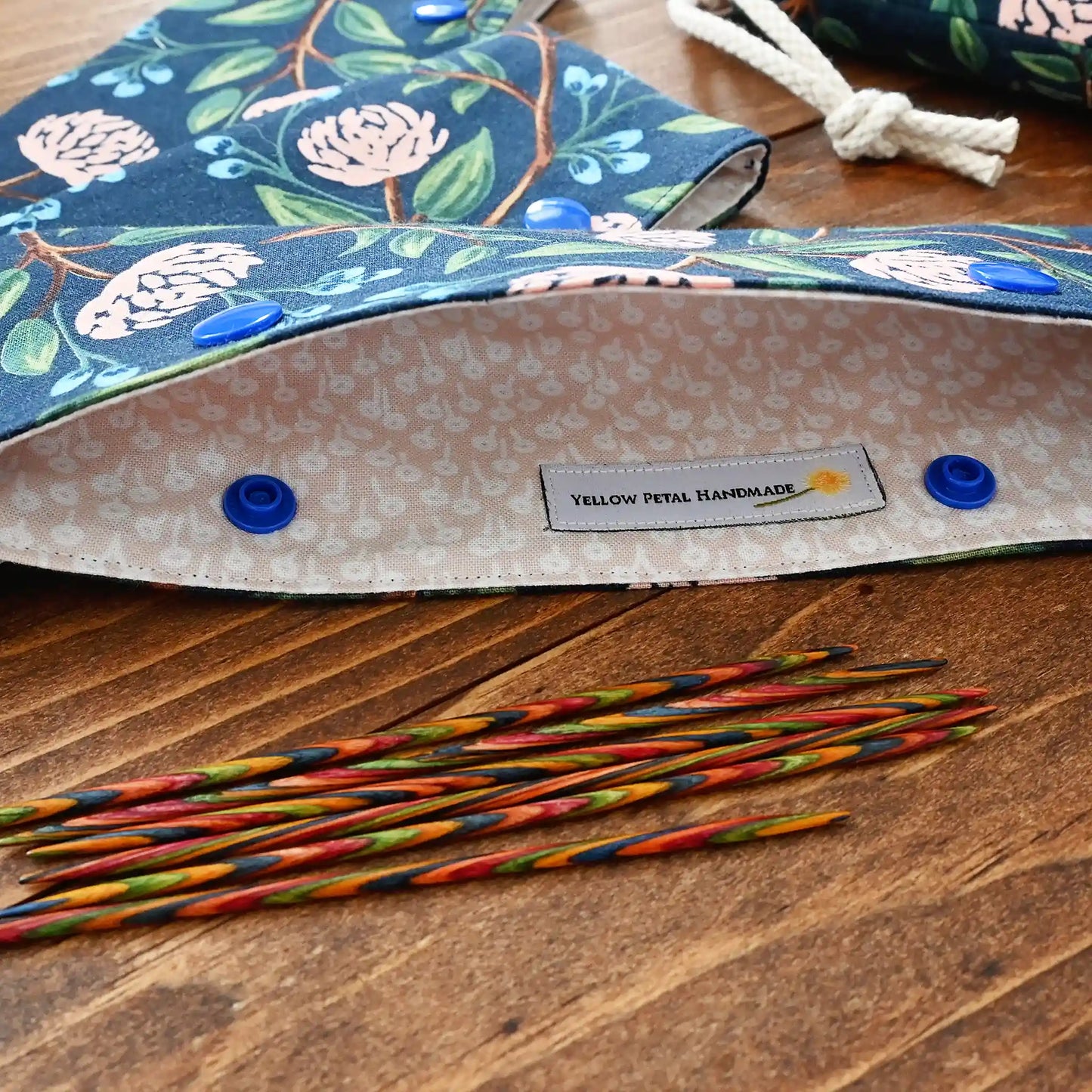 Pretty dpn cozy with snaps. Made in lovely navy peony fabric by Rifle Paper Co. Handmade in Nova Scotia, Canada by Yellow Petal Handmade.