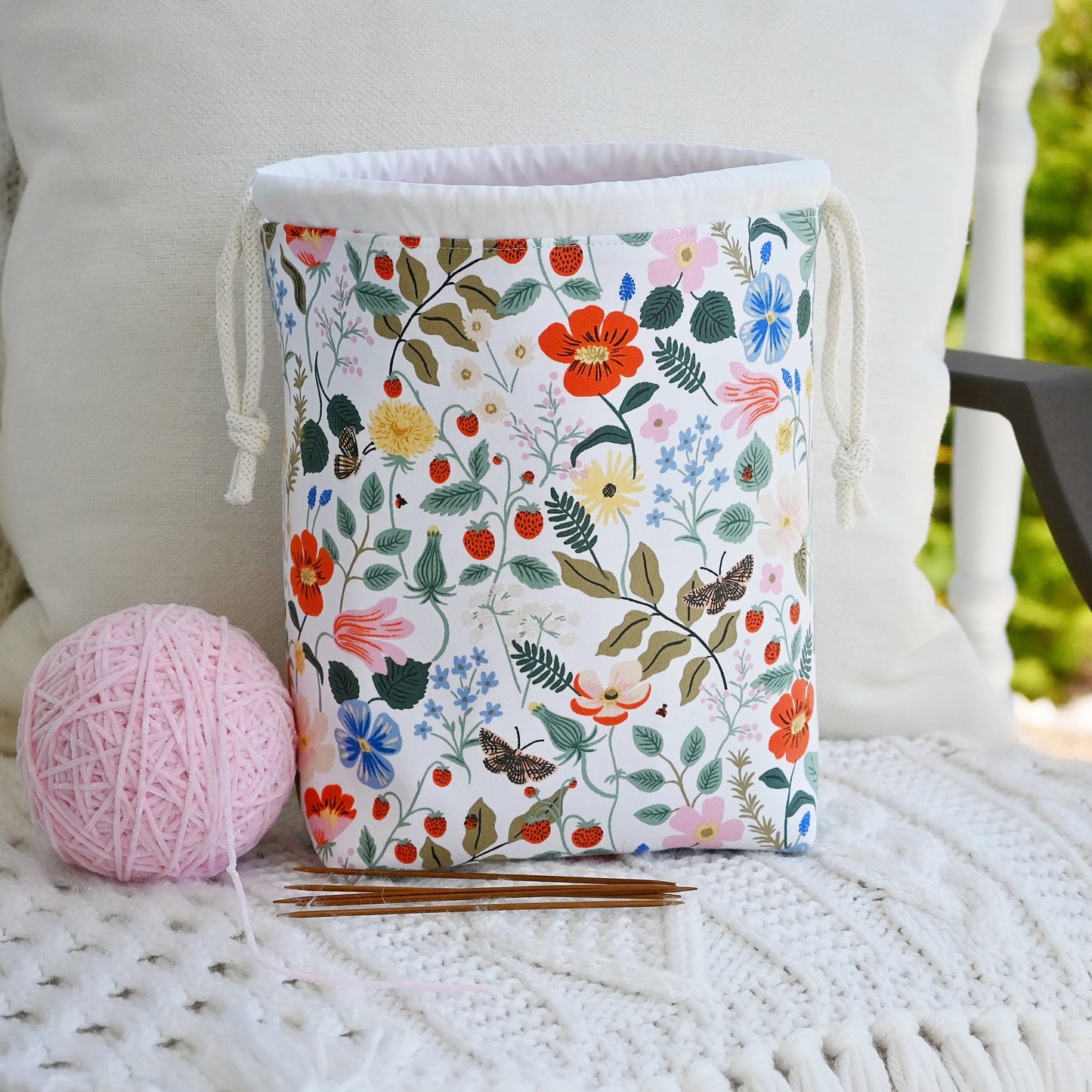 Small drawstring knitting bag with pockets. Made from Rifle Paper Co Strawberry Fields Fabric. Made in Nova Scotia, Canada by Yellow Petal Handmade.