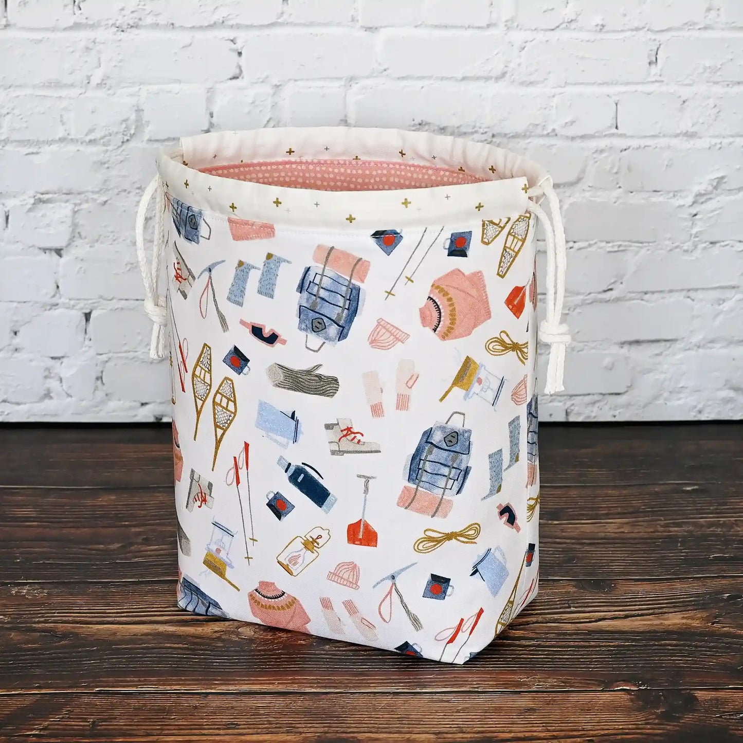 Pretty white, pink and blue winter themed project bag with drawstring closure. Made by Yellow Petal Handmade in Nova Scotia, Canada.