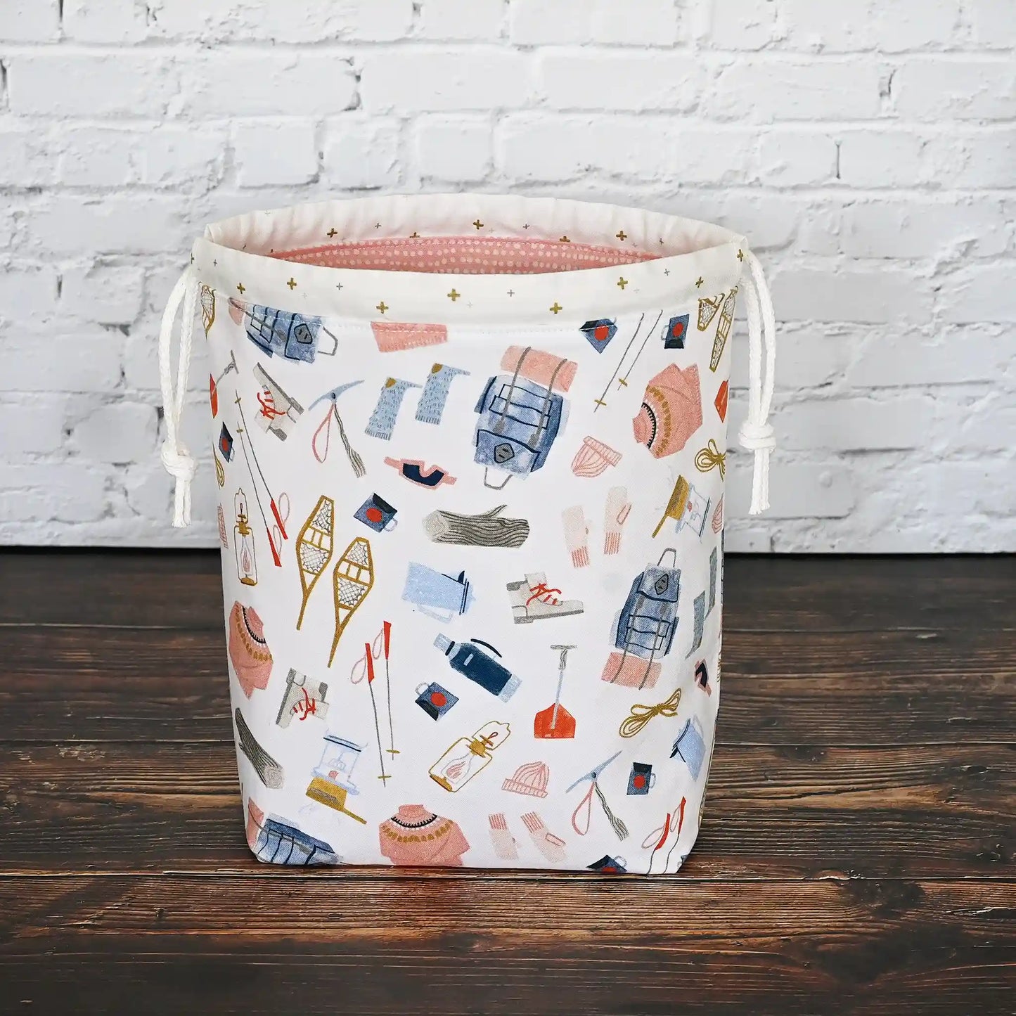 Pretty white, pink and blue winter themed project bag with drawstring closure. Made by Yellow Petal Handmade in Nova Scotia, Canada.