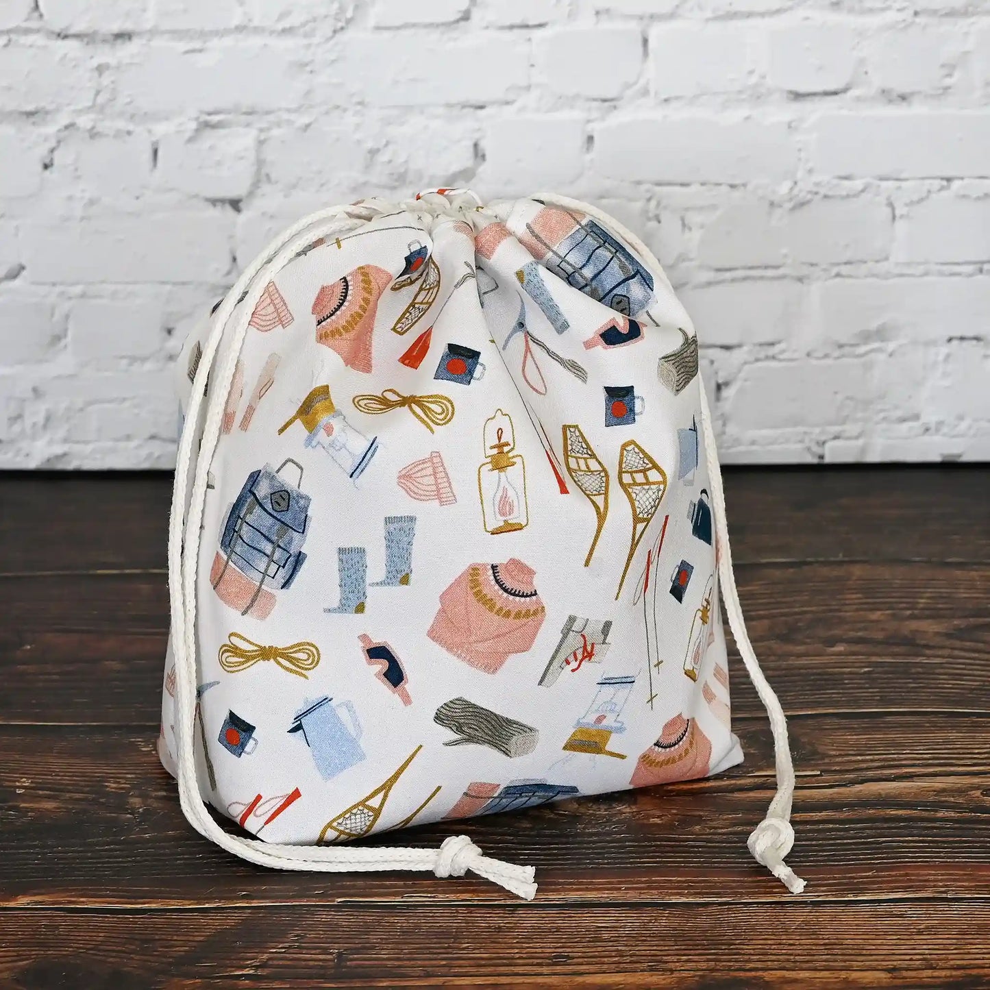 Pretty white, pink and blue winter themed project bag with drawstring closure. Made by Yellow Petal Handmade in Nova Scotia, Canada.