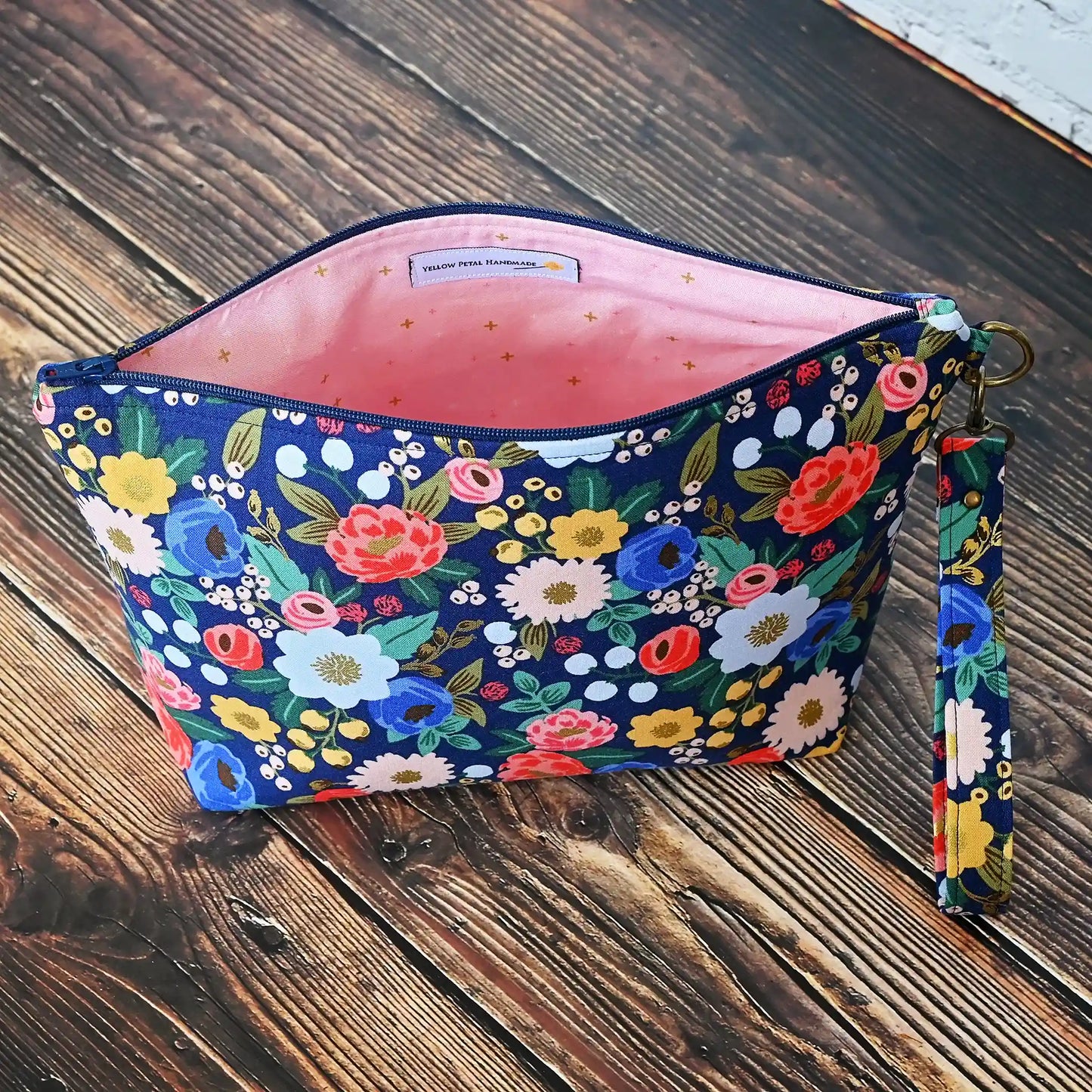 Pretty navy floral project bag with zipper and wrist strap. Made from Rifle Paper Co's Antique Garden. Made in Nova Scotia, Canada by Yellow Petal Handmade.