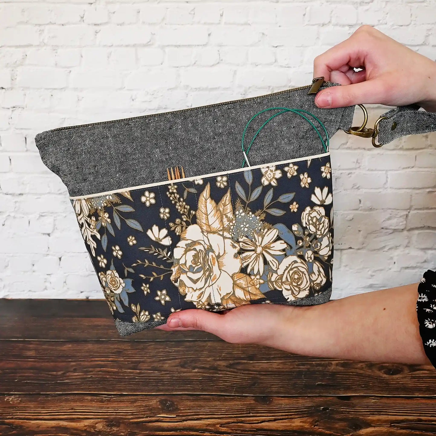 Beautiful linen project bag with exterior pockets made from a gorgeous navy floral cotton. Handmade in Canada by Yellow Petal Handmade.
