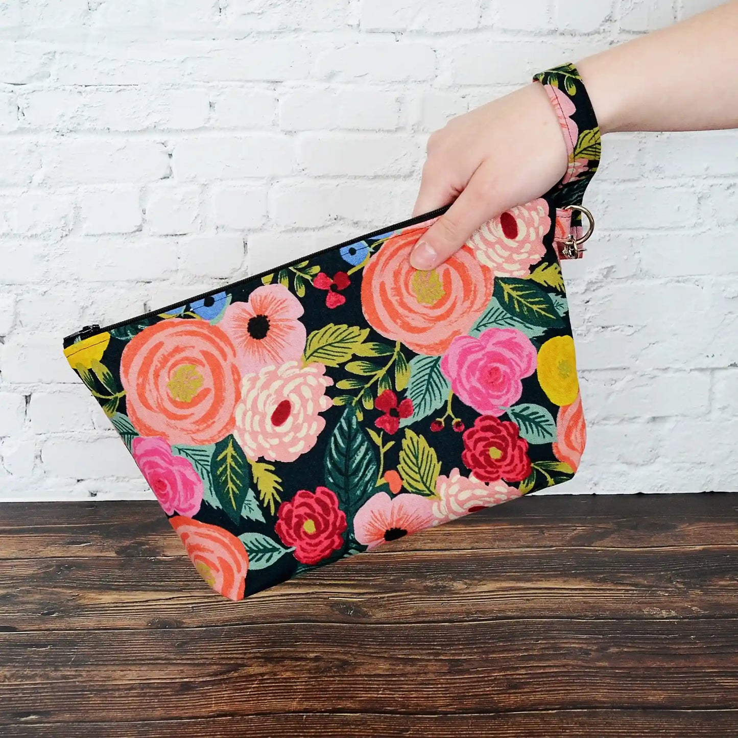 Canvas zippered project bag in a striking floral print with a black background. Designed for small projects using Rifle Paper Co. fabric. Made in Nova Scotia, Canada by Yellow Petal Handmade.