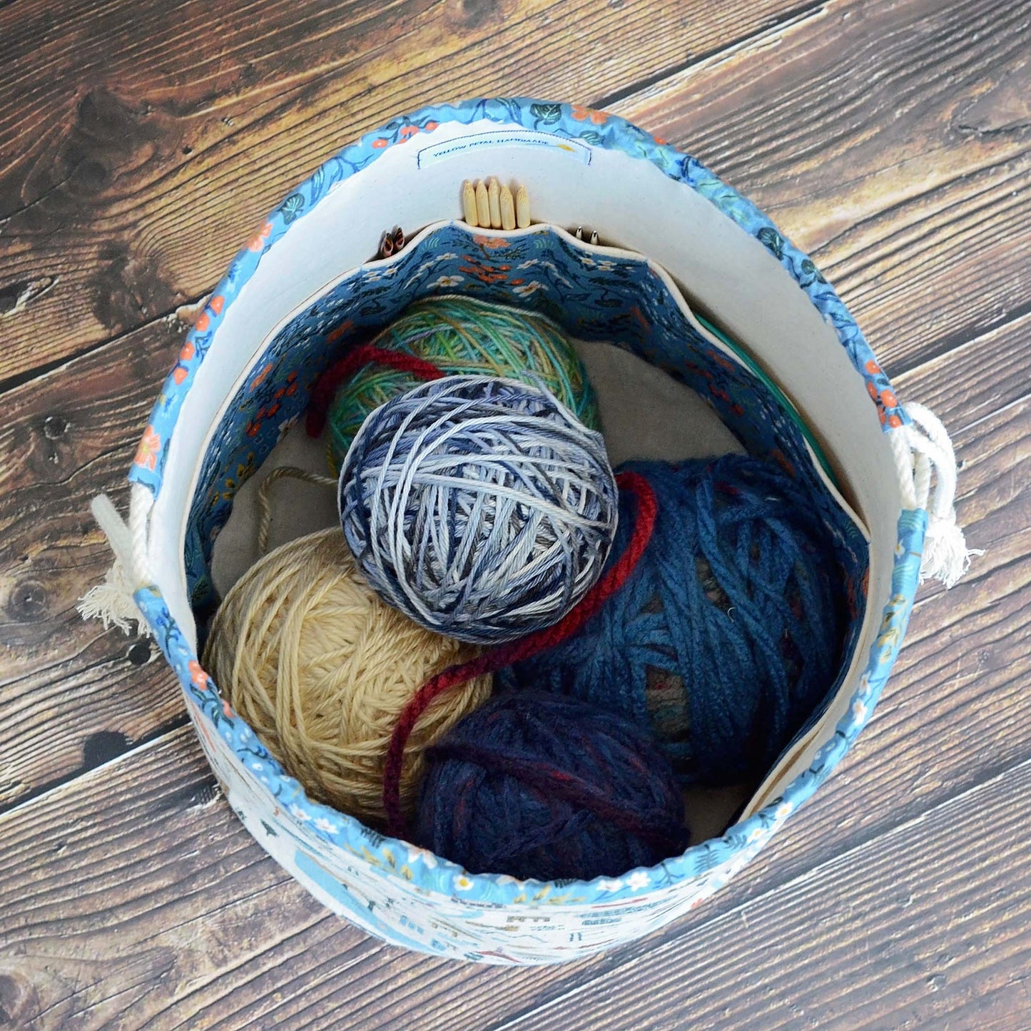 Travel themed bucket style knitting bag with plenty of interior pockets. Made from the Bon Voyage collection by Rifle Paper Co. Made in Canada by Yellow Petal Handmade.