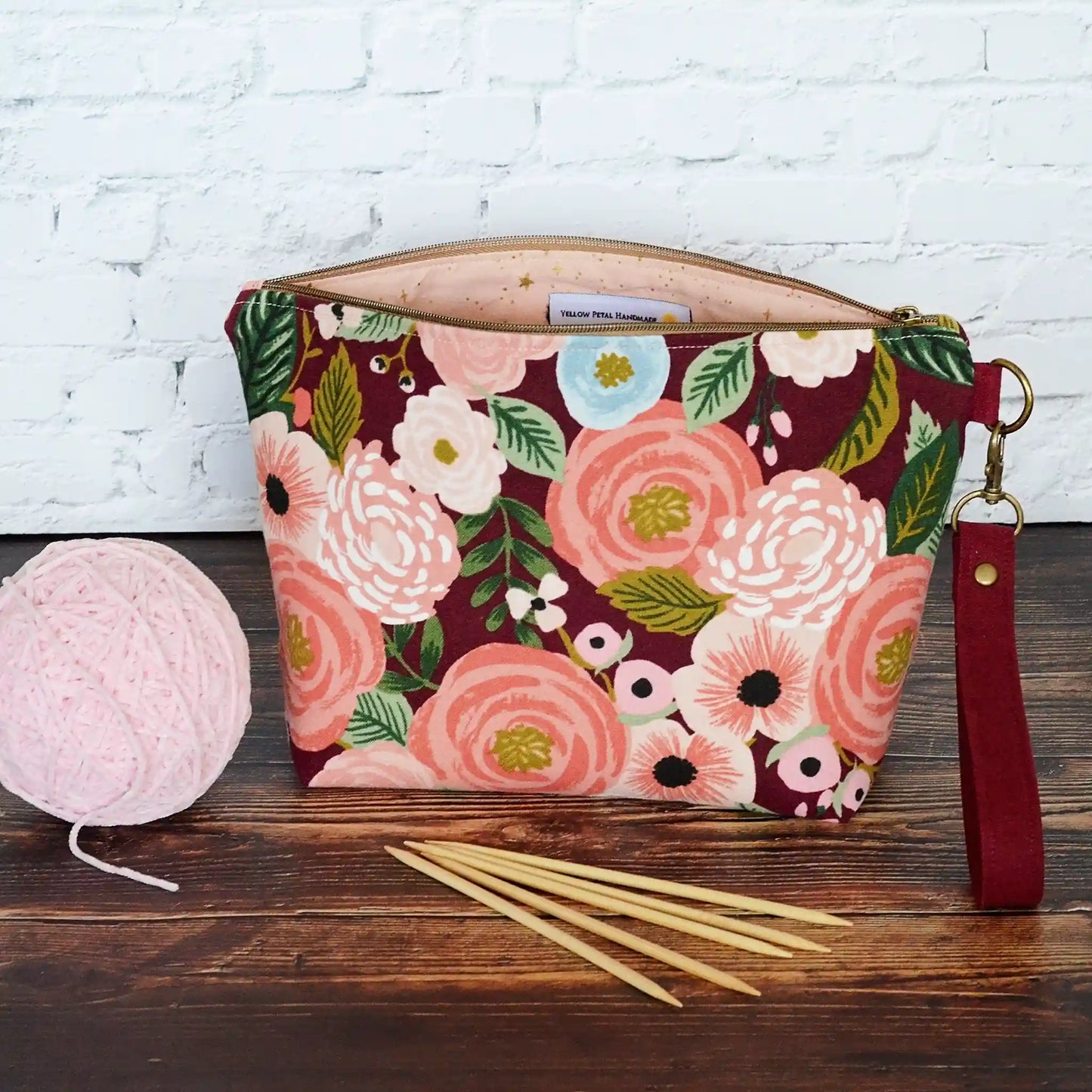 Burgundy floral canvas pouch with blush and metallic gold star lining. Made in Canada by Yellow Petal Handmade.