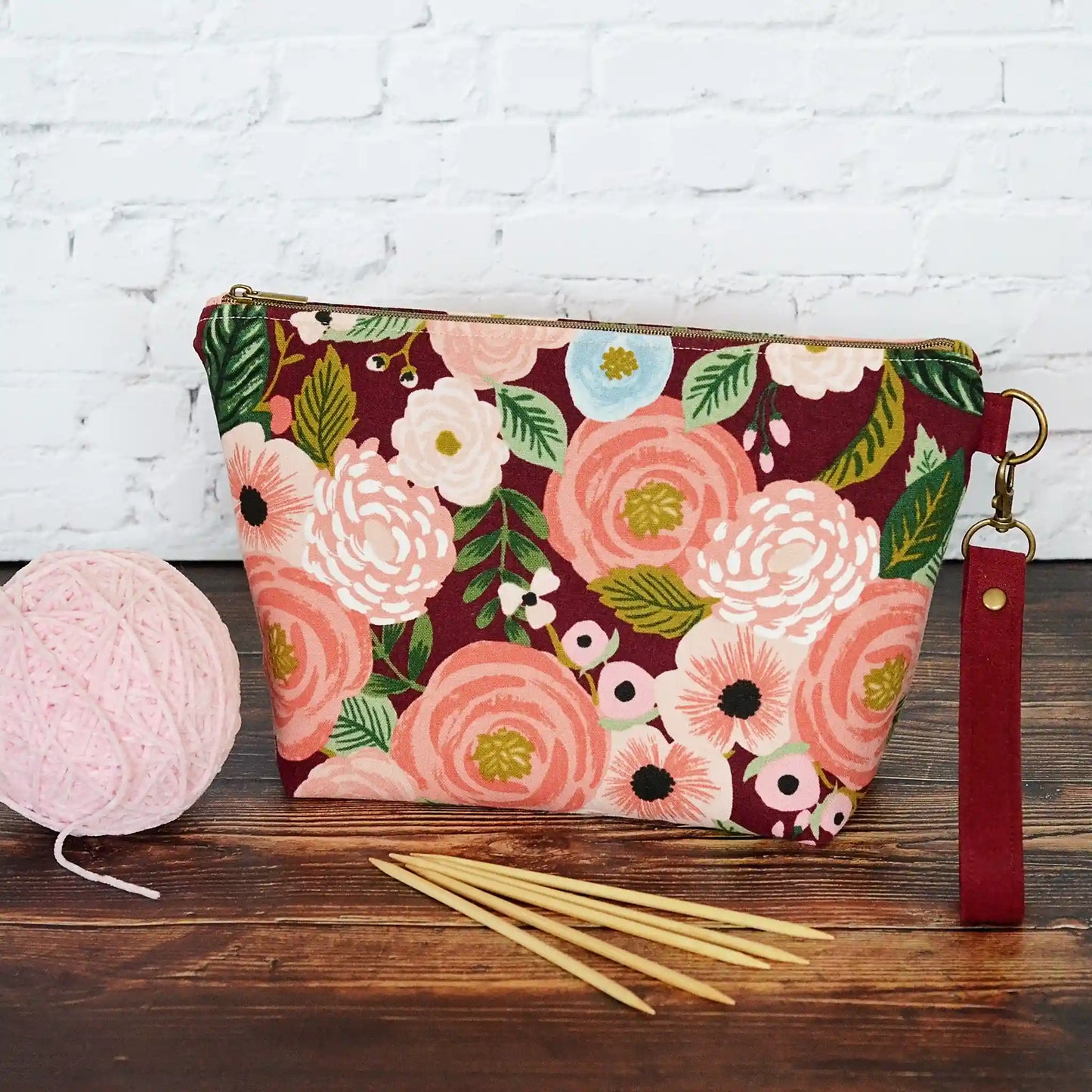 Burgundy floral canvas pouch with blush and metallic gold star lining. Made in Canada by Yellow Petal Handmade.