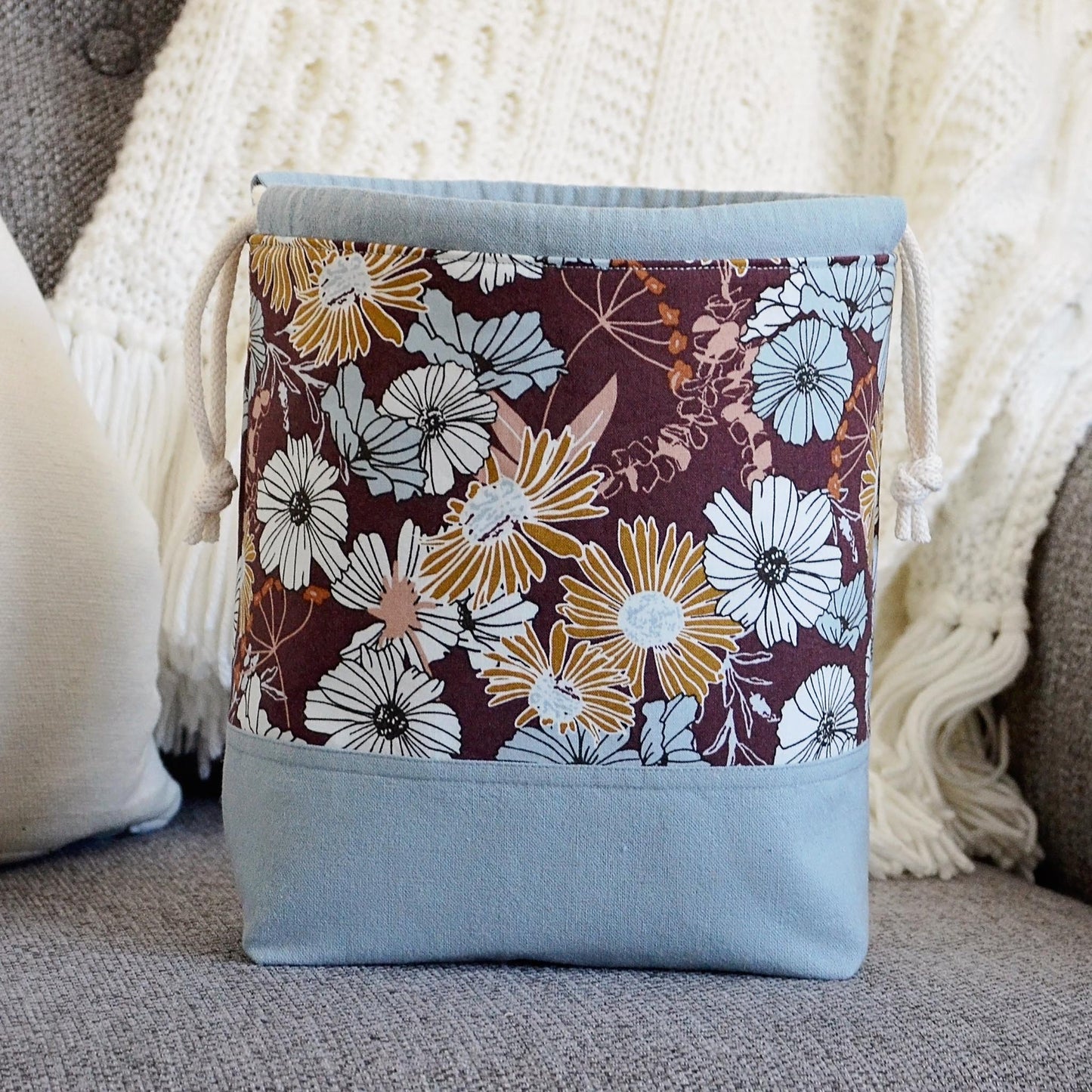 Small floral project bag for knitting or crochet in blues and browns. Made in Nova Scotia, Canada.
