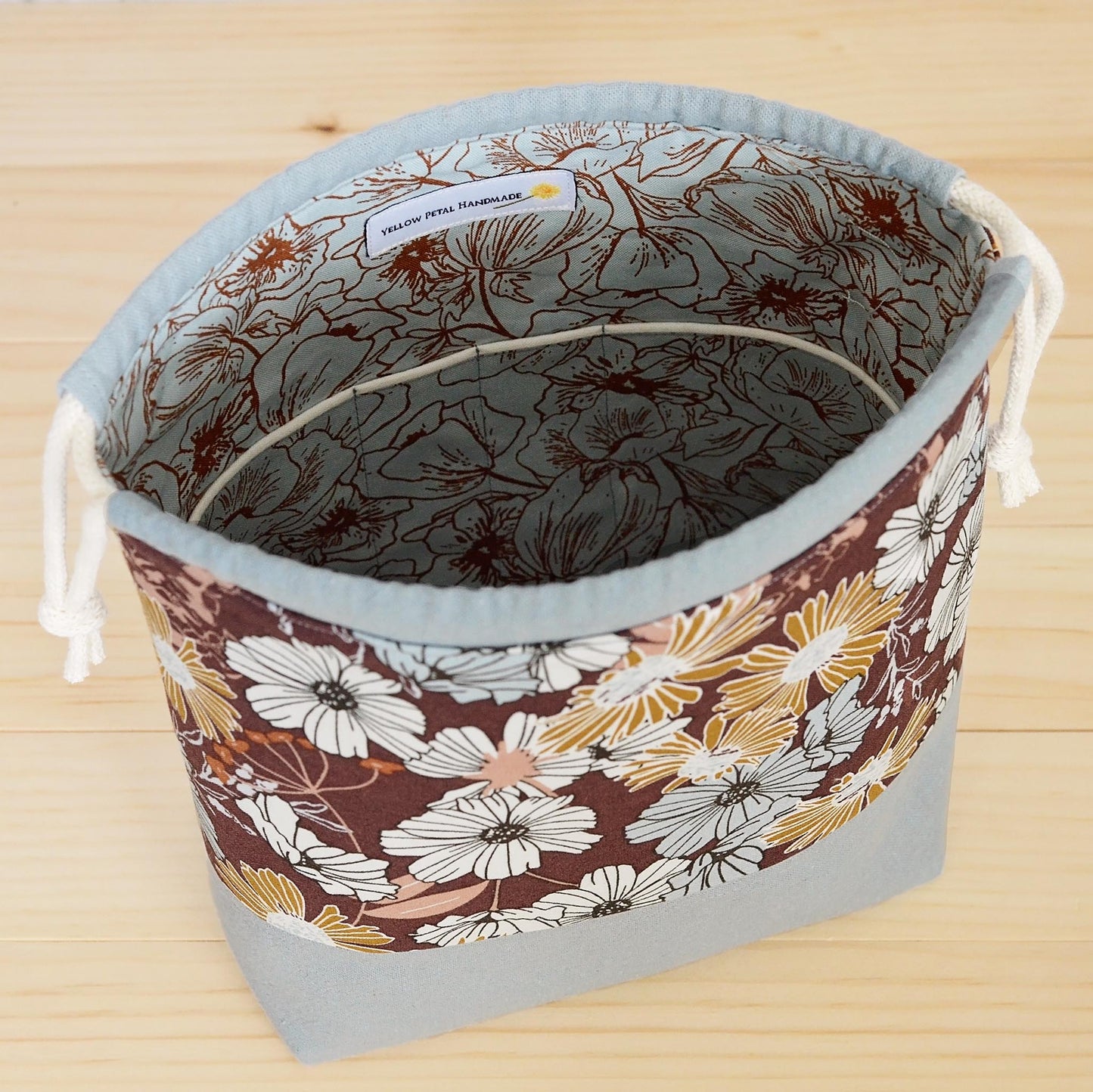 Small floral project bag for knitting or crochet with interior pockets. Made in Nova Scotia, Canada.