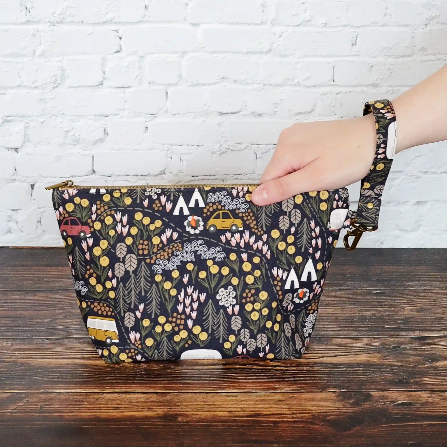 Small zippered project bag in camping fabric. Made in Canada by Yellow Petal Handmade.