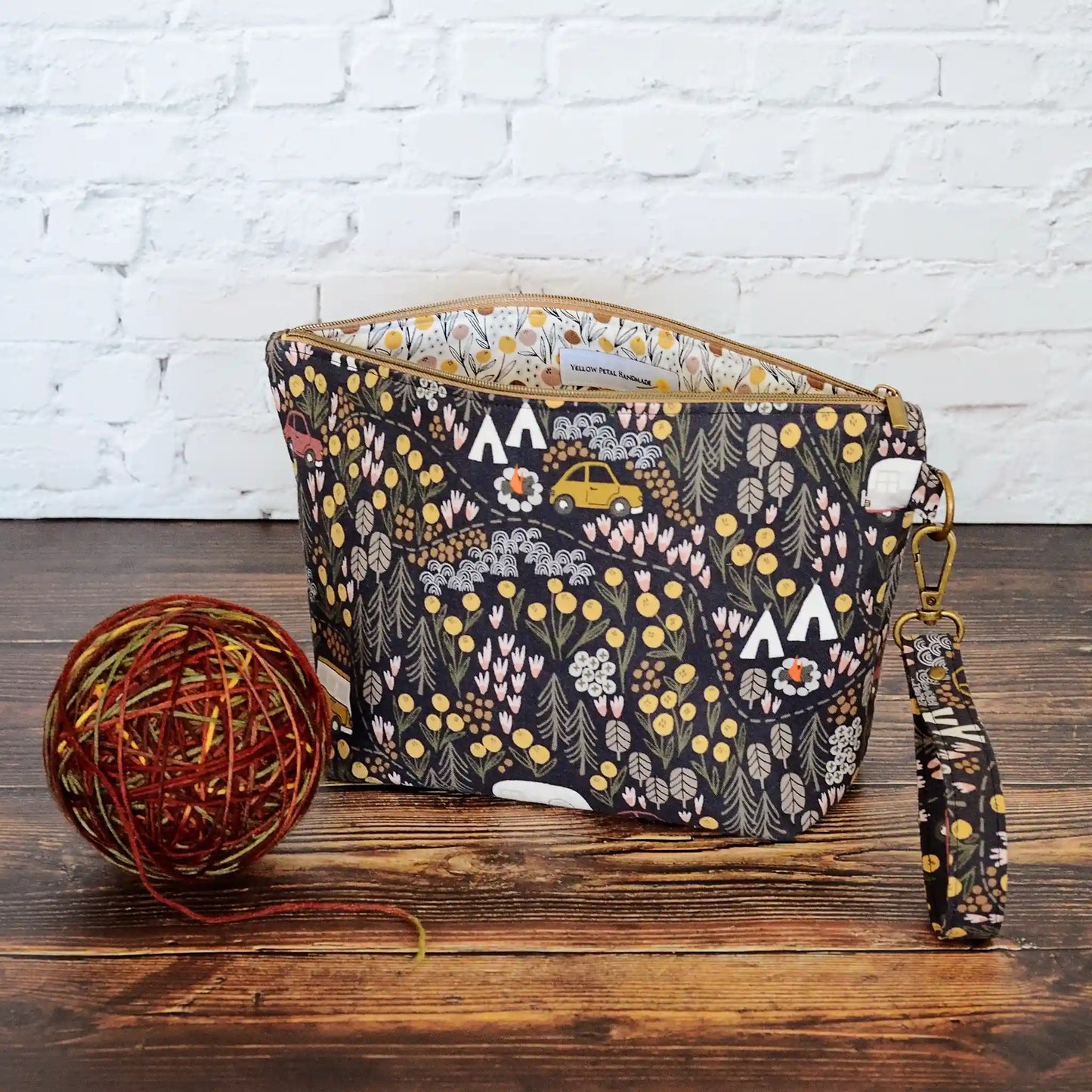 Small zippered project bag in camping fabric. Made in Canada by Yellow Petal Handmade.