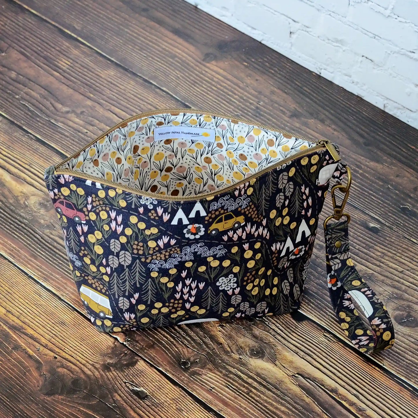Small zippered project bag in camping fabric. Made in Canada by Yellow Petal Handmade.