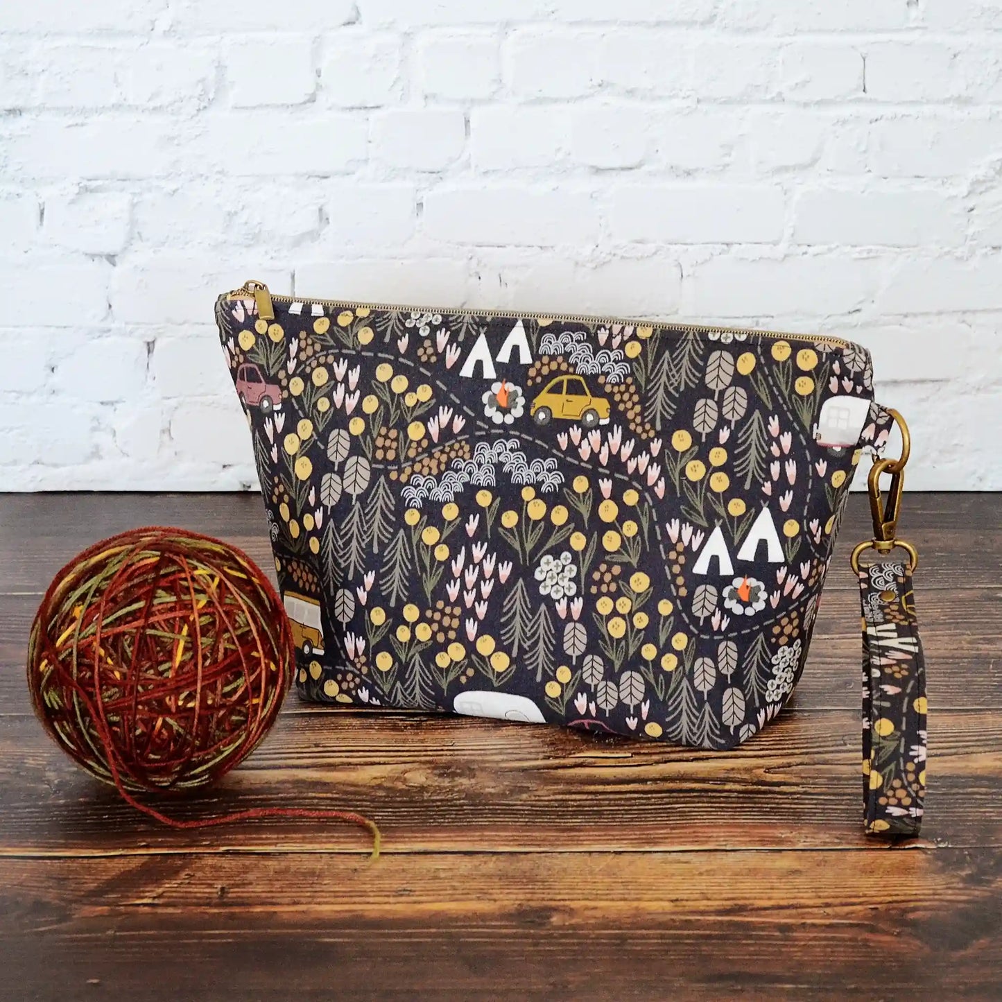Small zippered project bag in camping fabric. Made in Canada by Yellow Petal Handmade.