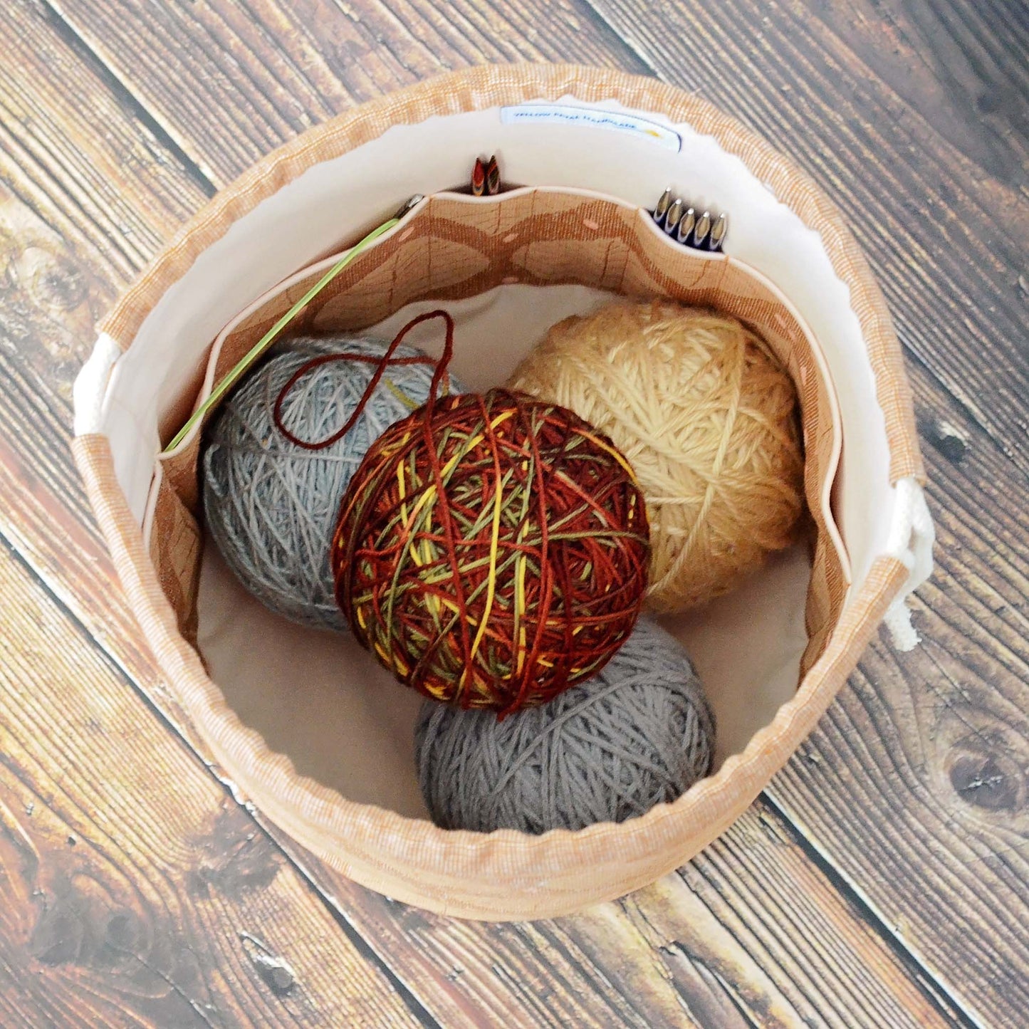 Brown linen knitting bag with leaves pattern. Made in Canada by Yellow Petal Handmade.