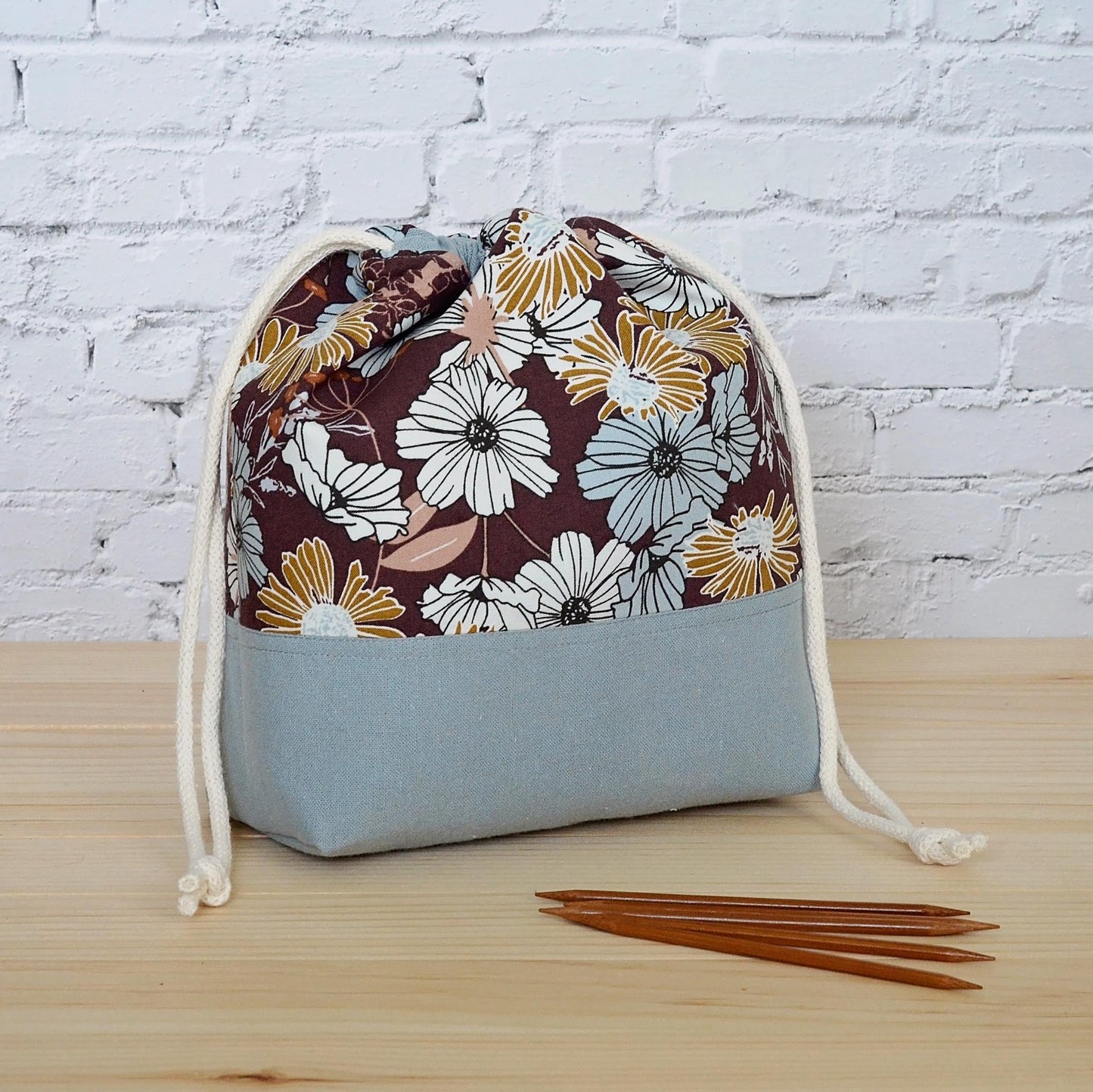 Small floral project bag for knitting or crochet in blues and browns. Made in Nova Scotia, Canada.