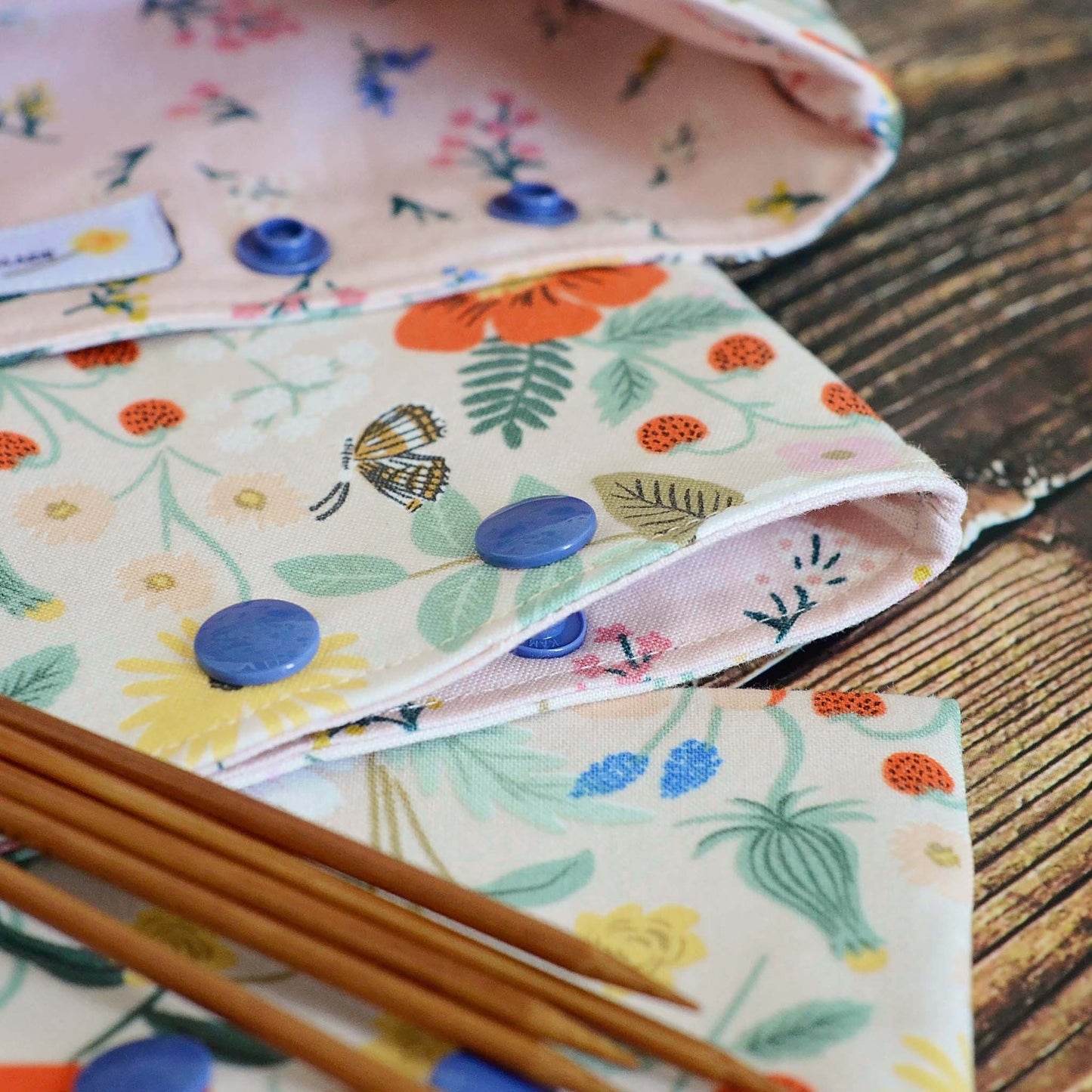 Pretty pink dpn cozies in Strawberry Fields fabric by Rifle Paper Co. Made in Canada by Yellow Petal Handmade.