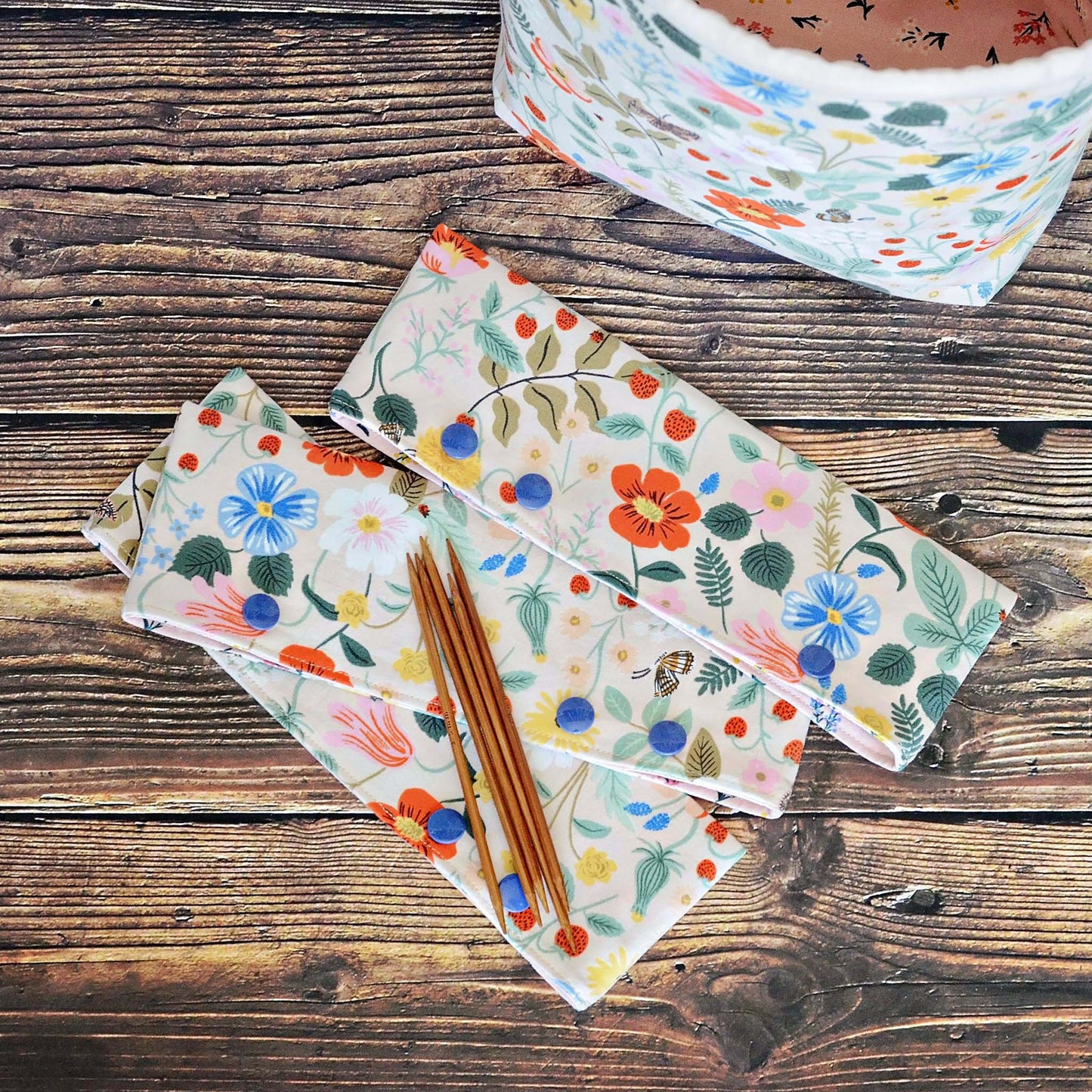 Pretty pink dpn cozies in Strawberry Fields fabric by Rifle Paper Co. Made in Canada by Yellow Petal Handmade.