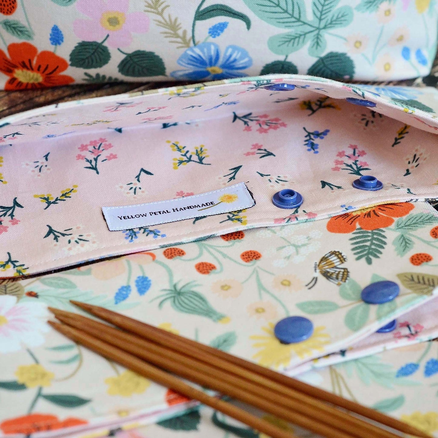 Pretty pink dpn cozies in Strawberry Fields fabric by Rifle Paper Co. Made in Canada by Yellow Petal Handmade.