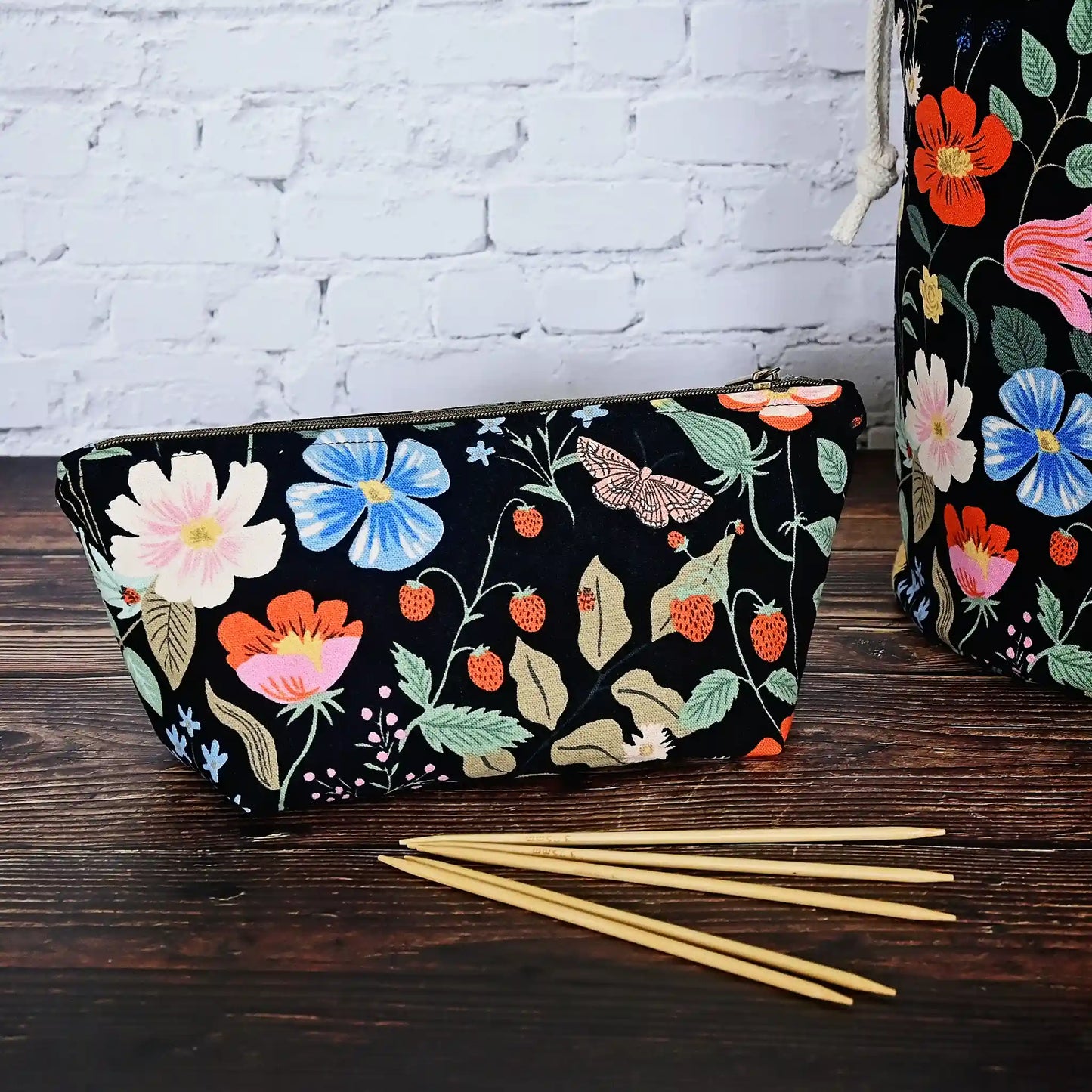 Cute black floral canvas accessory pouch in Rifle Paper Co's Strawberry Fields collection.  Shown with 6" dpns.  Made in Canada by Yellow Petal Handmade.