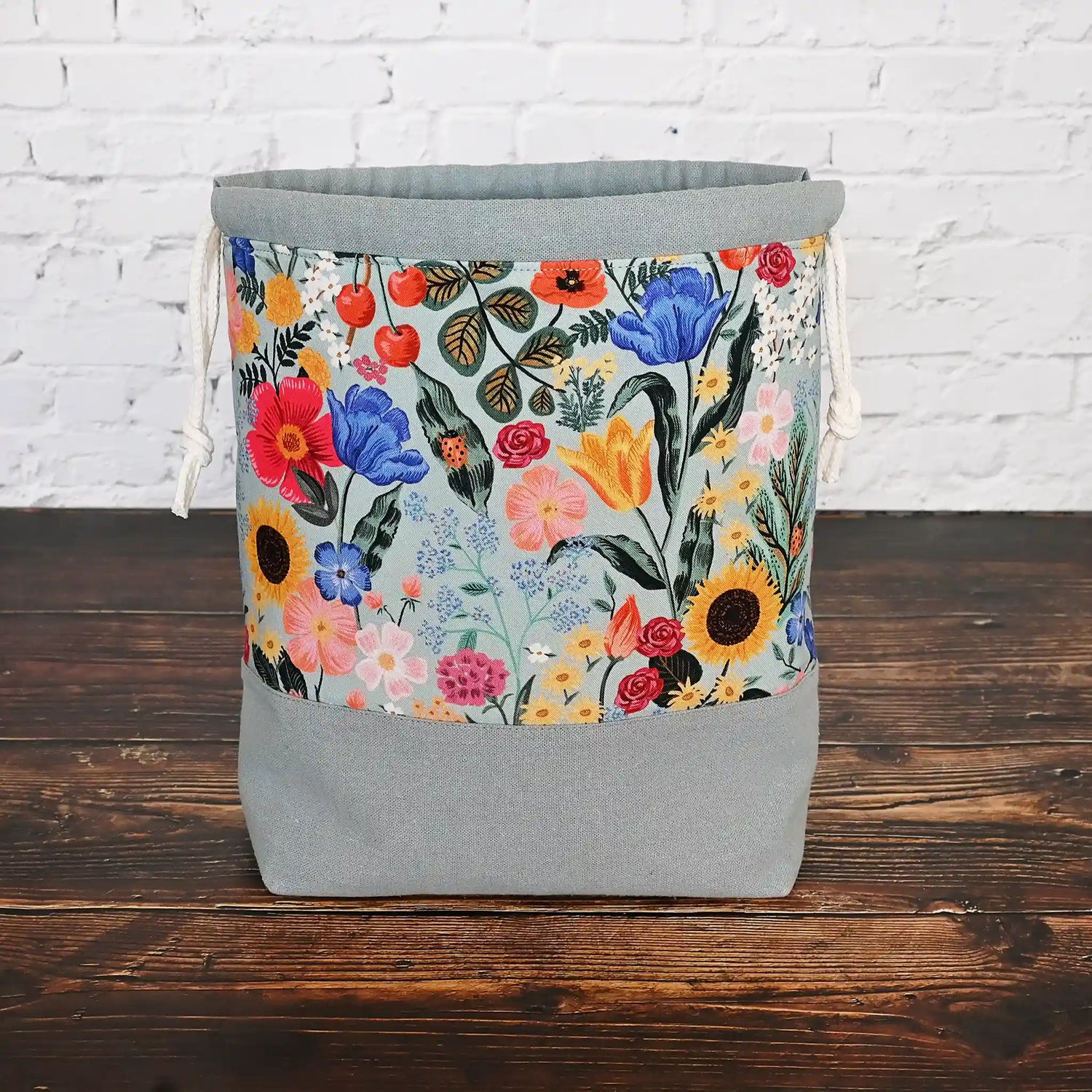 Pretty muted blue grey floral project bag with pockets and a drawstring closure.  This bag is made with Rifle Paper Co's Curio collection, inside and out.  Made in Canada by Yellow Petal Handmade.