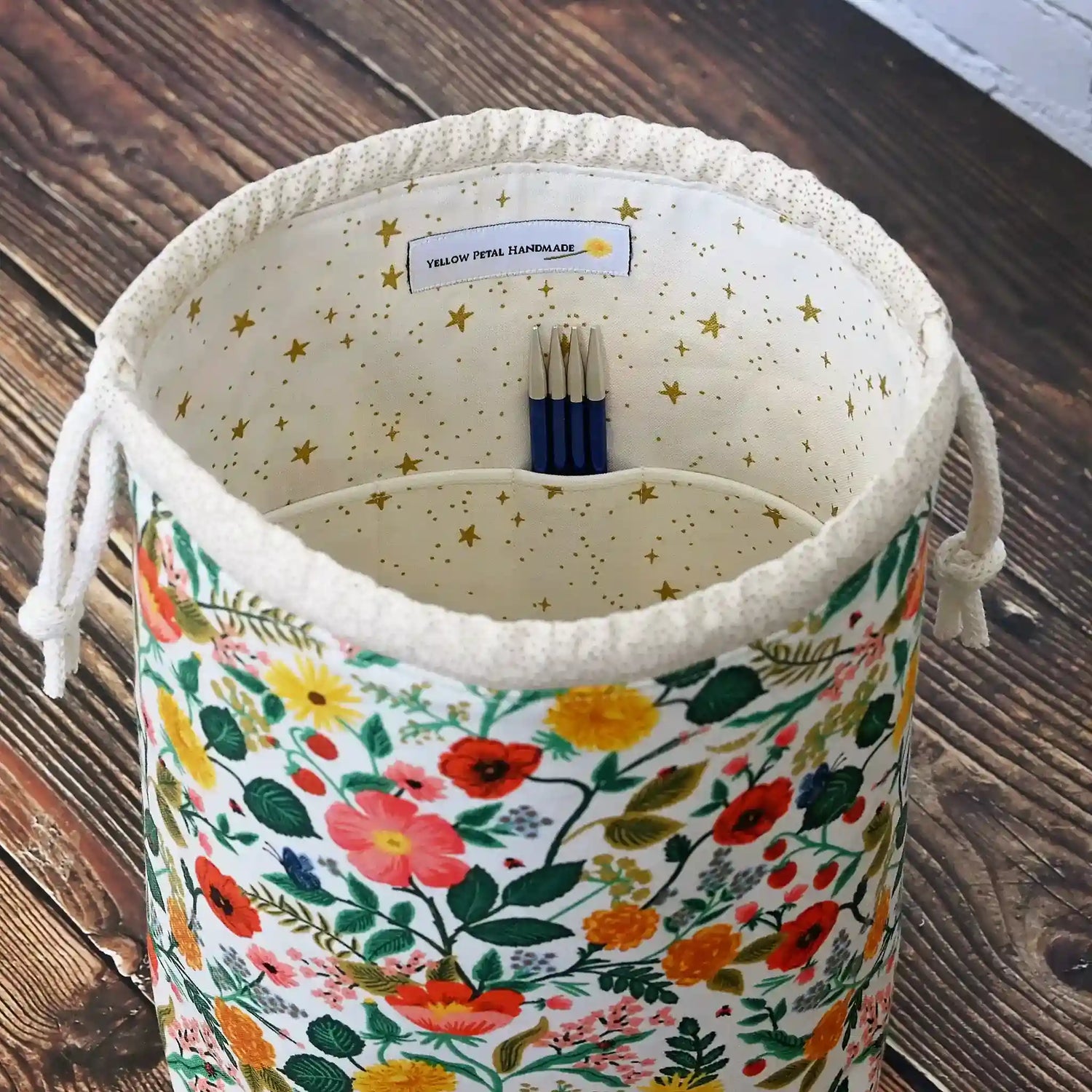 Pretty drawstring project bag.  Made from Rifle Paper Camont Fabric and lined in a pretty cream with gold stars.  Made in Canada by Yellow Petal Handmade.