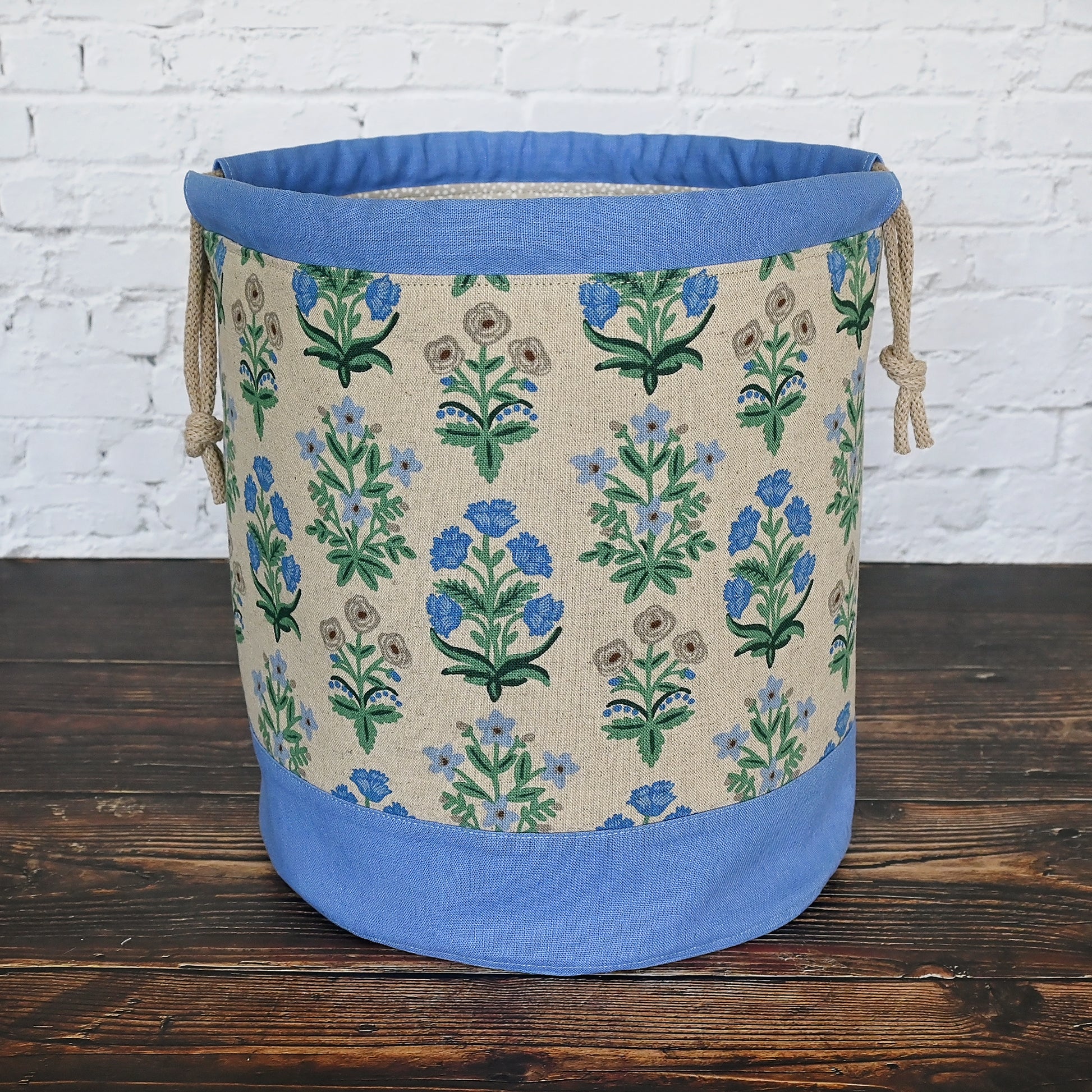 Canvas bucket bag in a pretty floral and periwinkle canvas/linen combinations.  Made with plenty of interior pockets and a quilted bottom for stability and design.  Made in Canada by Yellow Petal Handmade.