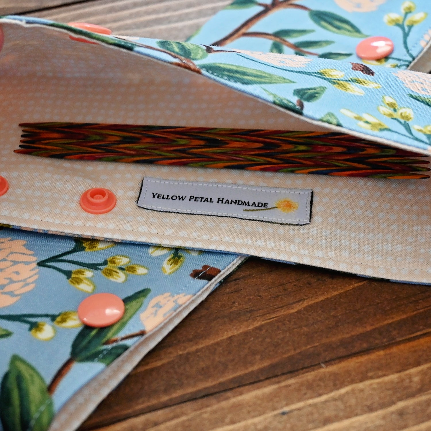 Pretty floral DPN cozies, perfect for keeping your projects on the needles!  Crafted with a blue and peach floral from Rifle Paper Co, these close with snaps and hold your needles (and project) in place.  Made in Canada by Yellow Petal Handmade.