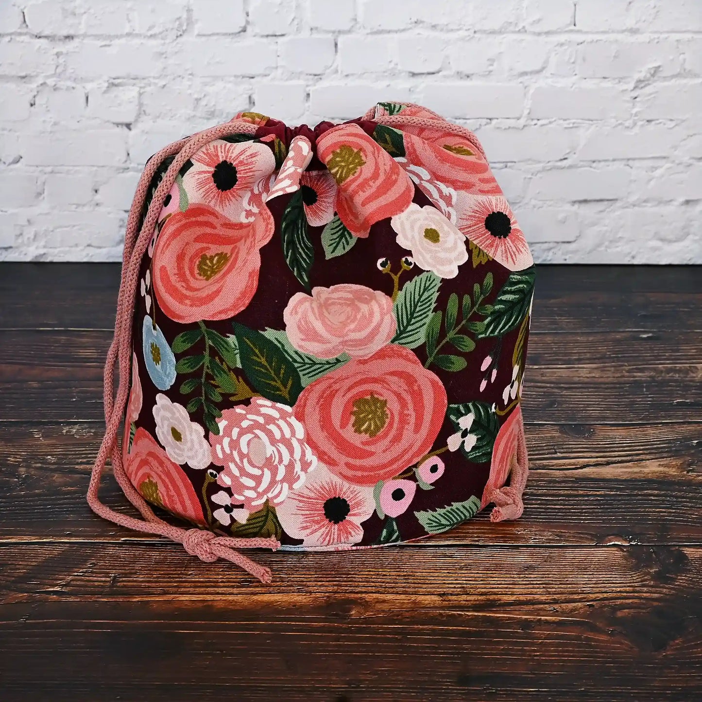 Beautiful burgundy floral bucket bag for knitting or crochet projects.  Made from canvas from the Garden Party collection by Rifle Paper Co and lined in  a pretty blush floral.  This bag has lots of pockets and is quilted on the bottom for stability and design.  Made in Canada by Yellow Petal Handmade.