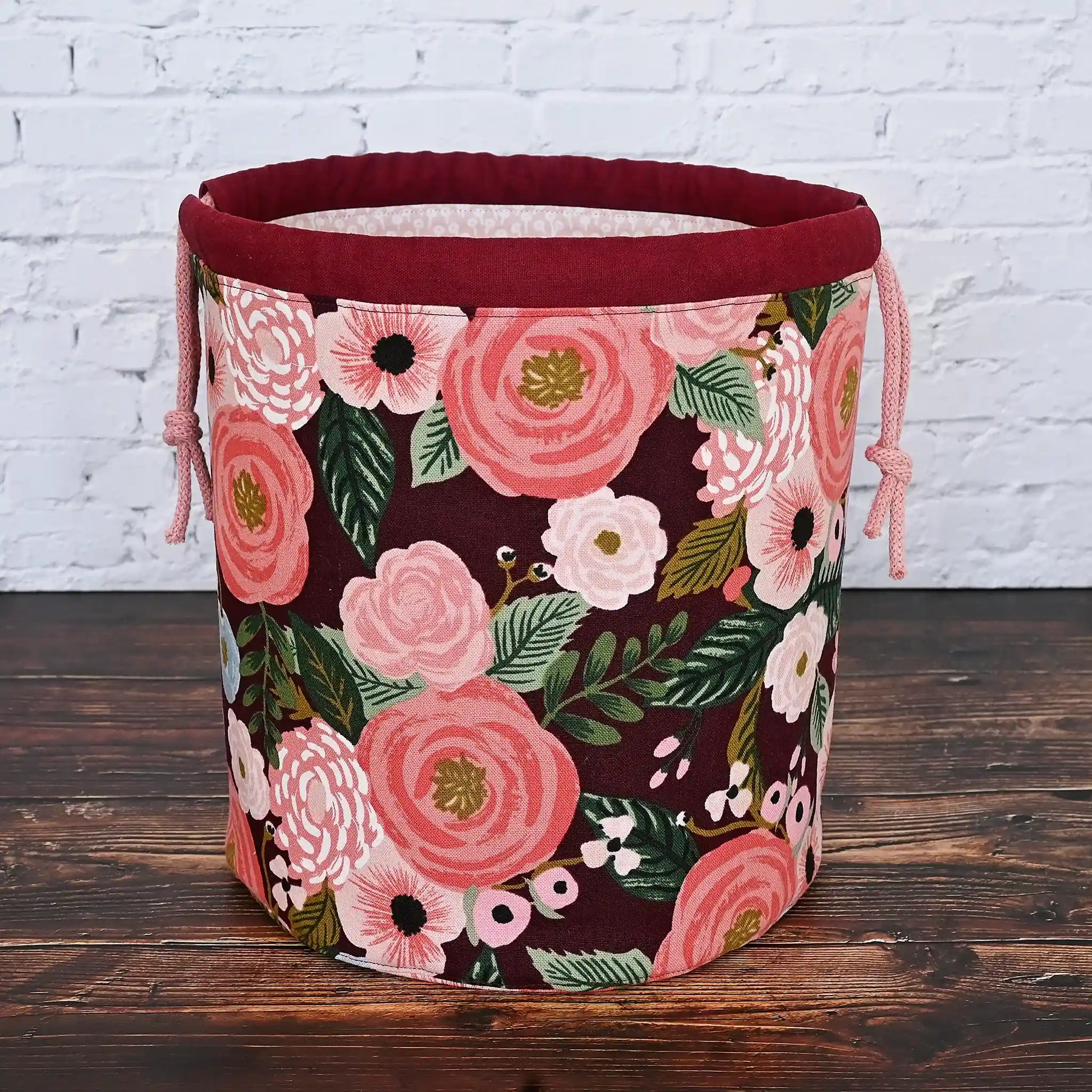 Beautiful burgundy floral bucket bag for knitting or crochet projects.  Made from canvas from the Garden Party collection by Rifle Paper Co and lined in  a pretty blush floral.  This bag has lots of pockets and is quilted on the bottom for stability and design.  Made in Canada by Yellow Petal Handmade.