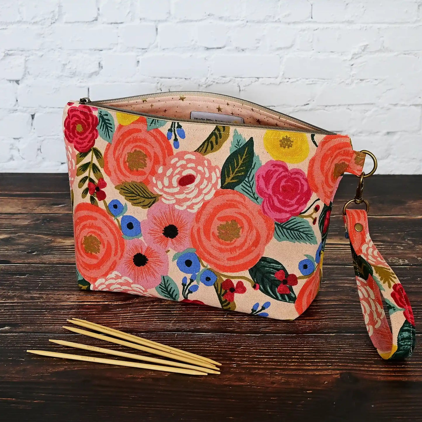Pretty peach floral canvas pouch with removable wrist strap.  Lined in peach cotton with Gold Stars.  All fabrics from Rifle Paper Co.  Made in Nova Scotia, Canada by Yellow Petal Handmade.