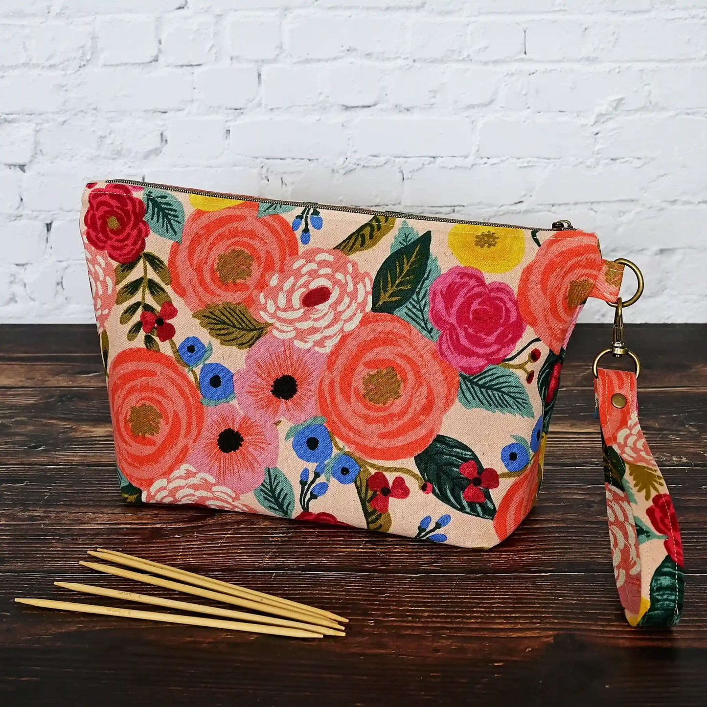 Pretty peach floral canvas pouch with removable wrist strap.  Lined in peach cotton with Gold Stars.  All fabrics from Rifle Paper Co.  Made in Nova Scotia, Canada by Yellow Petal Handmade.