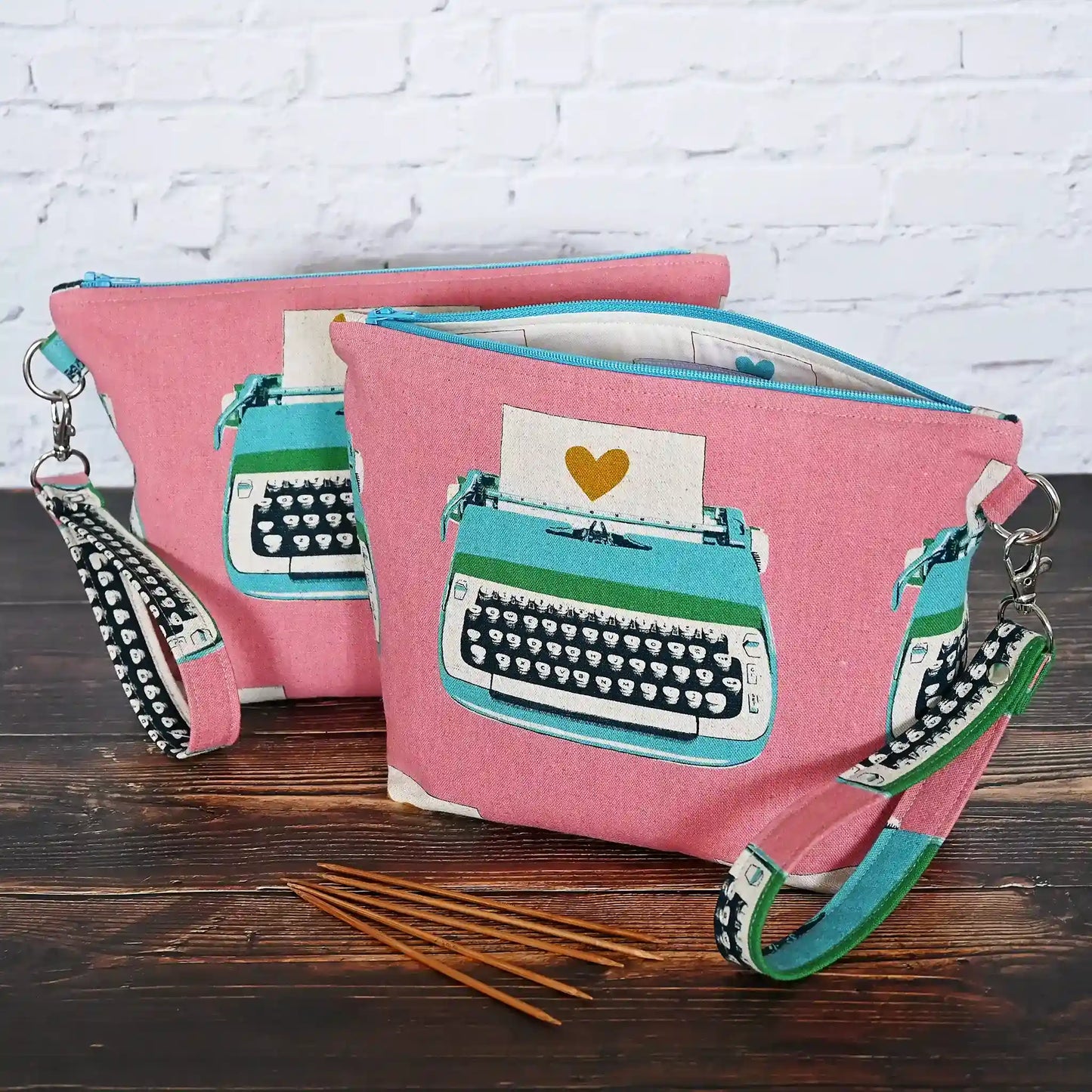 Fun project bag in a fun pink vintage typewriter canvas and lined in a cotton from the same collection.  Comes with a removable wrist strap.  Made in Canada by Yellow Petal Handmade.