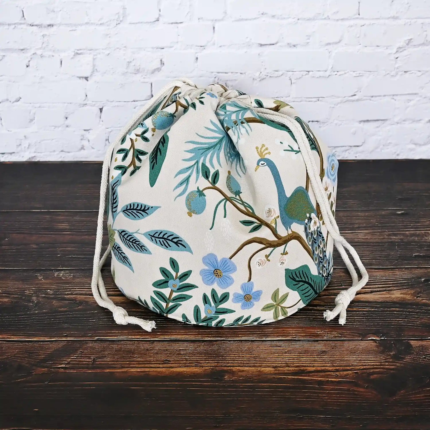 Beautiful canvas bucket bag in Rifle Paper Co's Antique Garden fabric, featuring green and teal florals and peacocks.  Made in Nova Scotia, Canada by Yellow Petal Handmade.