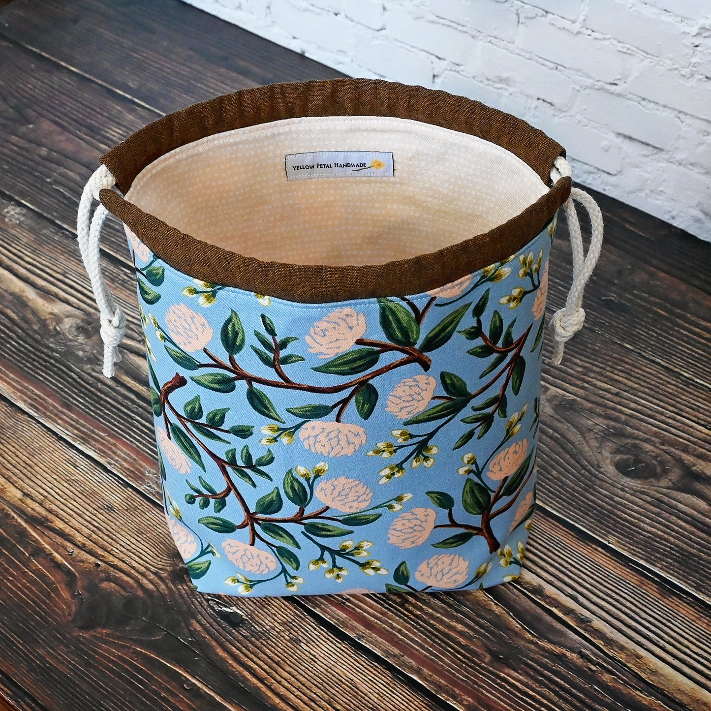 Pretty blue and peach drawstring project bag made from Peonies fabric by Rifle Paper Co.  Lined in a pale peach dotted fabric.  Made in Canada by Yellow Petal Handmade.