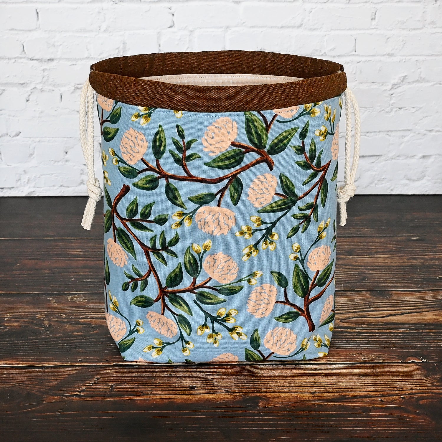 Pretty blue and peach drawstring project bag made from Peonies fabric by Rifle Paper Co.  Lined in a pale peach dotted fabric.  Made in Canada by Yellow Petal Handmade.