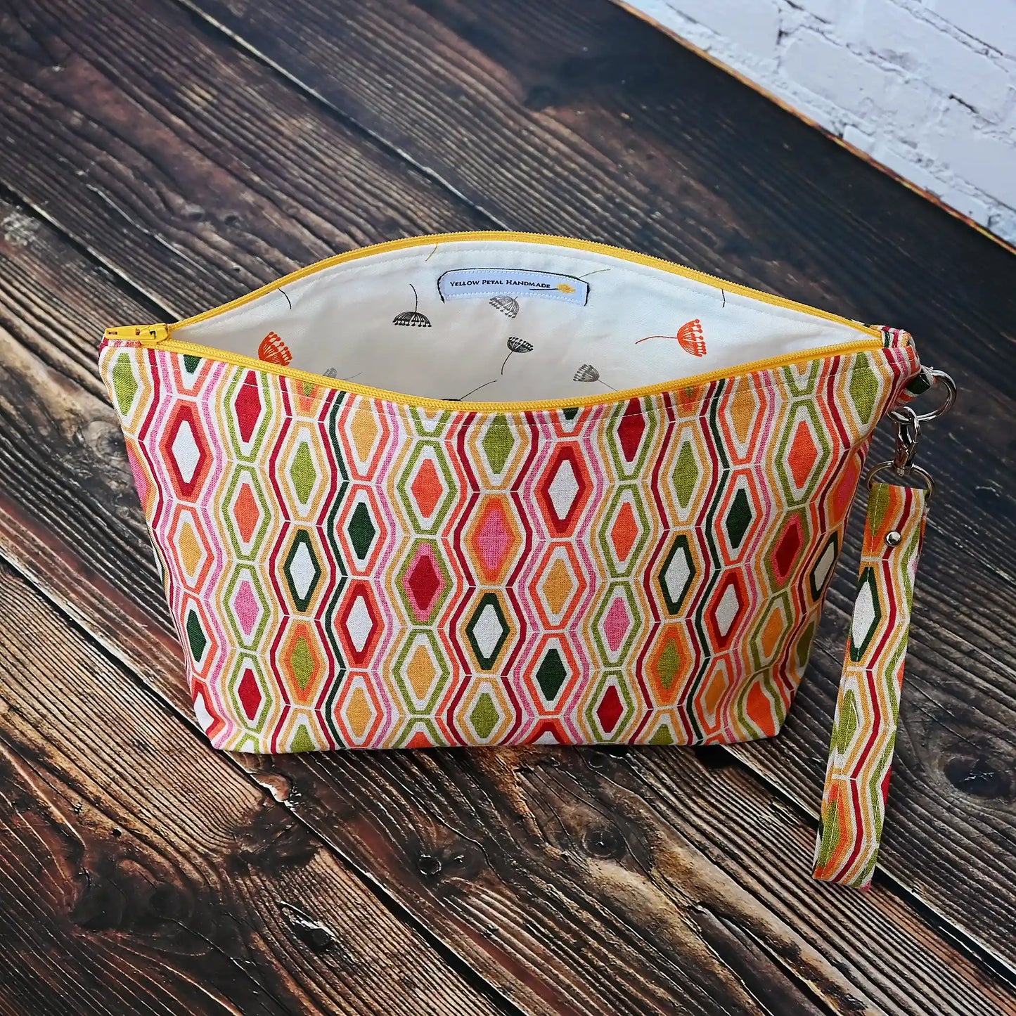 Striking retro jewel tone pouch with removable wrist strap.  Made in Canada by Yellow Petal Handmade.