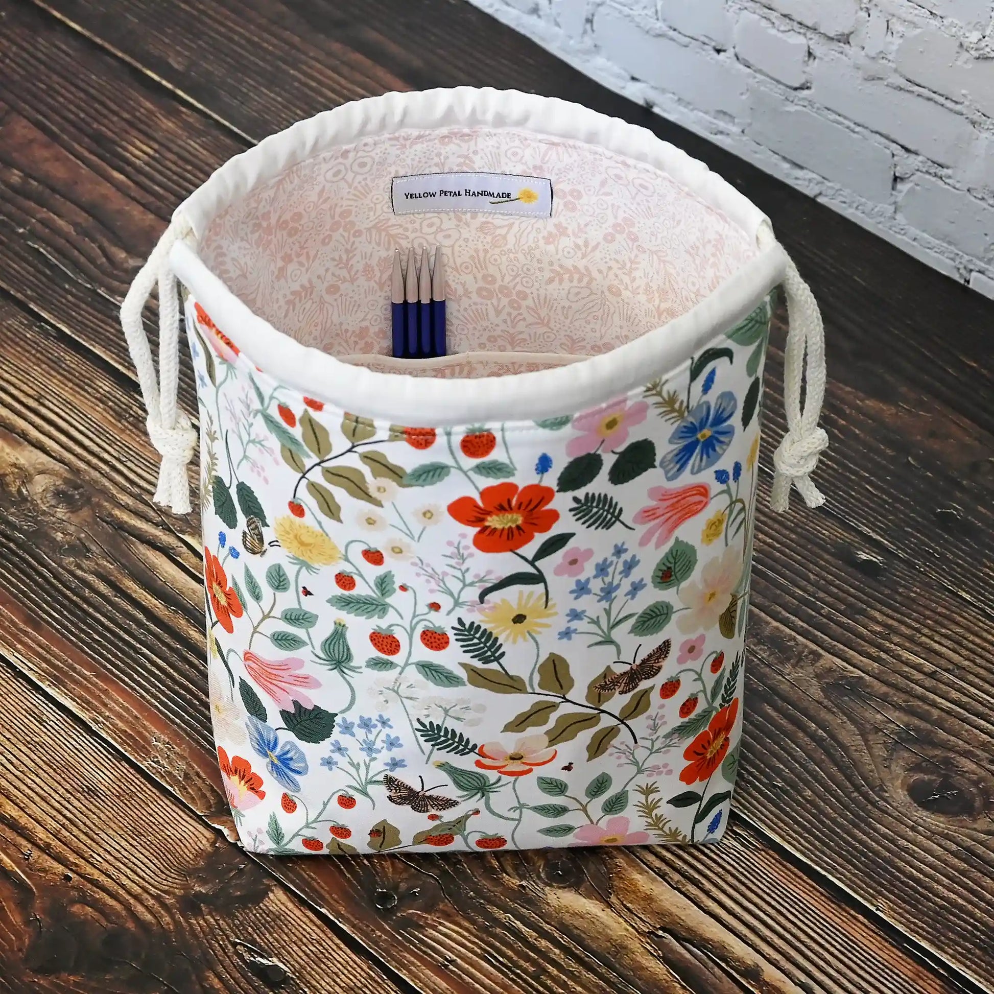 Small drawstring knitting bag with pockets.  Made from Rifle Paper Co Strawberry Fields Fabric.  Made in Nova Scotia, Canada by Yellow Petal Handmade.