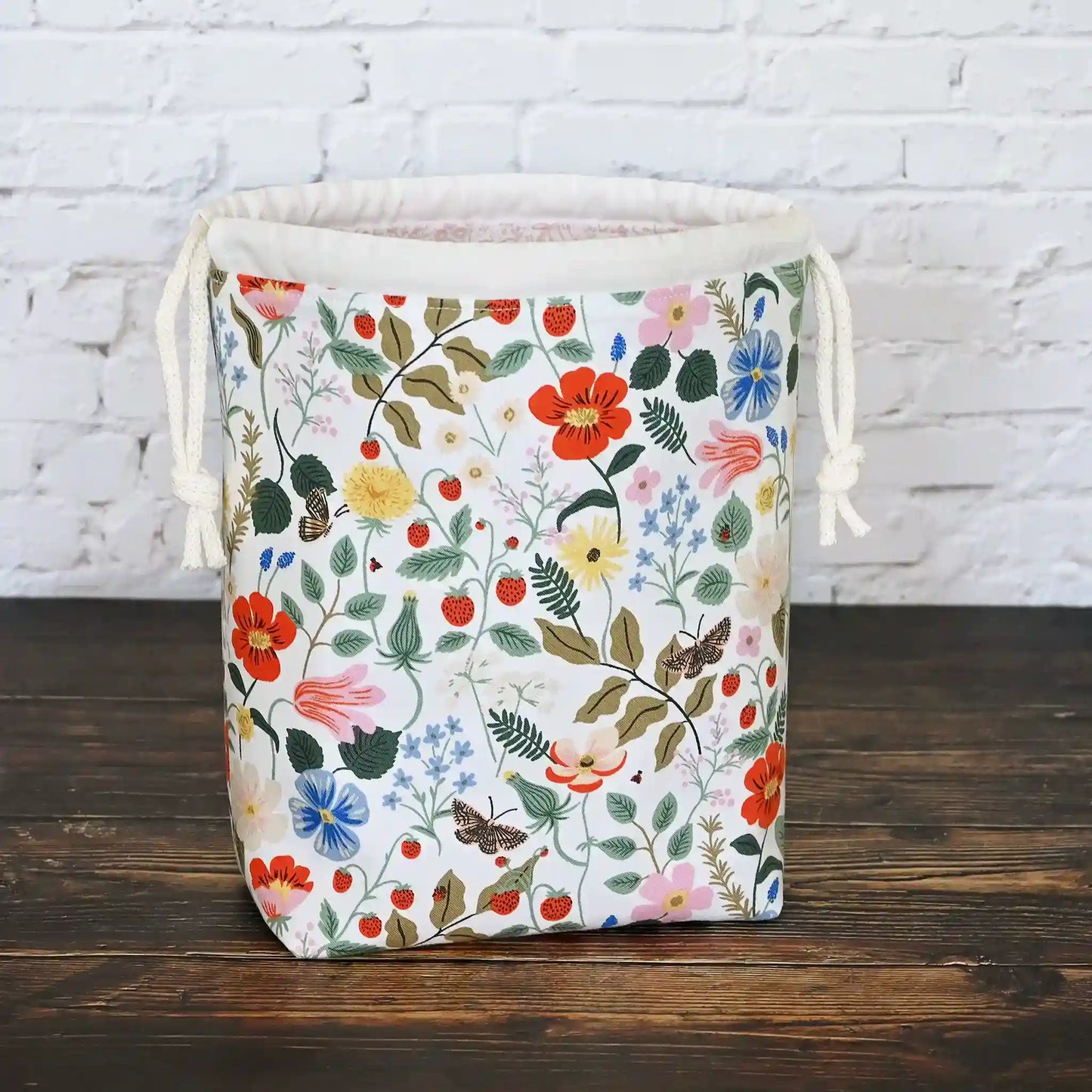 Small drawstring knitting bag with pockets.  Made from Rifle Paper Co Strawberry Fields Fabric.  Made in Nova Scotia, Canada by Yellow Petal Handmade.